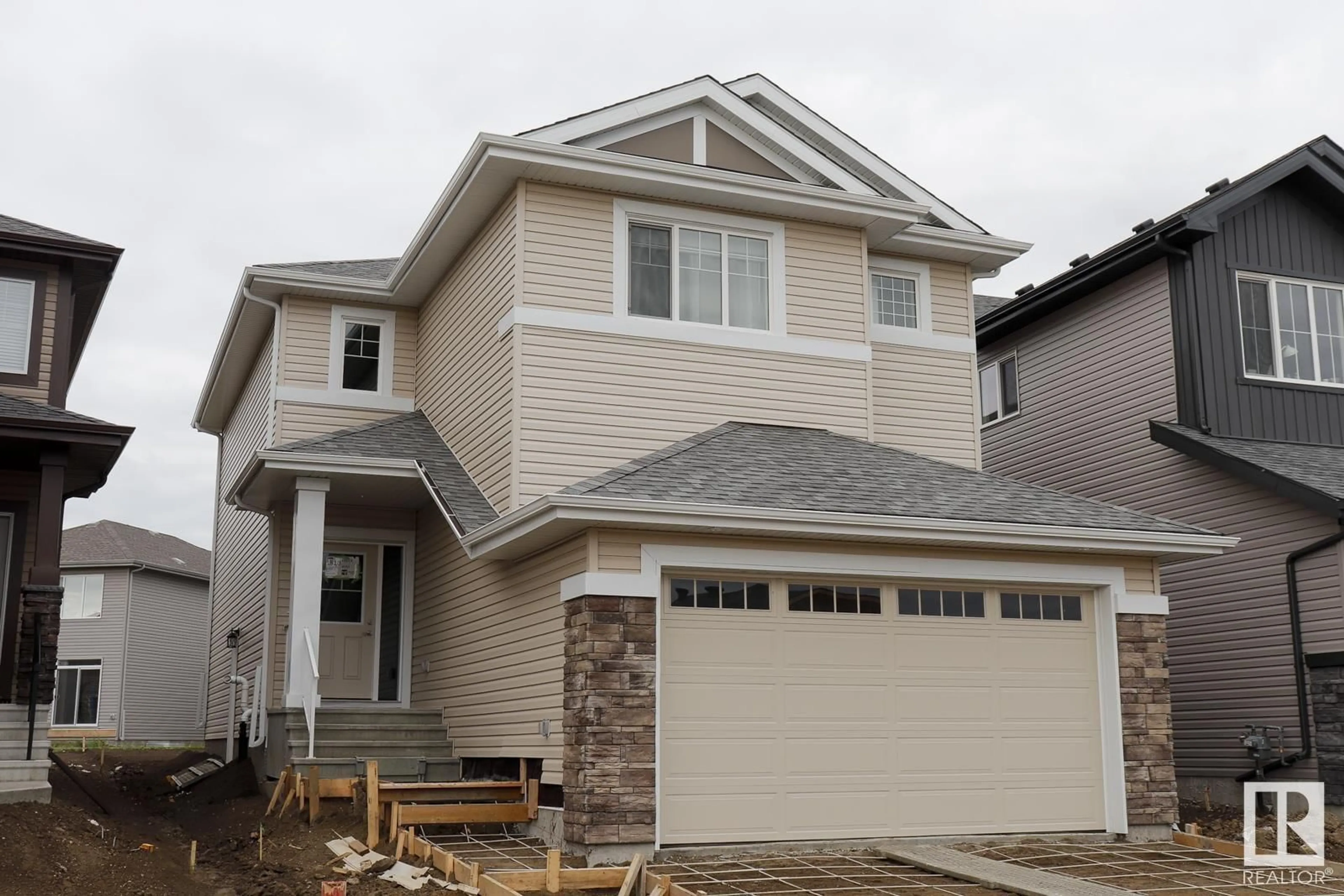 Home with vinyl exterior material, street for 1510 ERKER LINK LI NW, Edmonton Alberta T6M0Z7