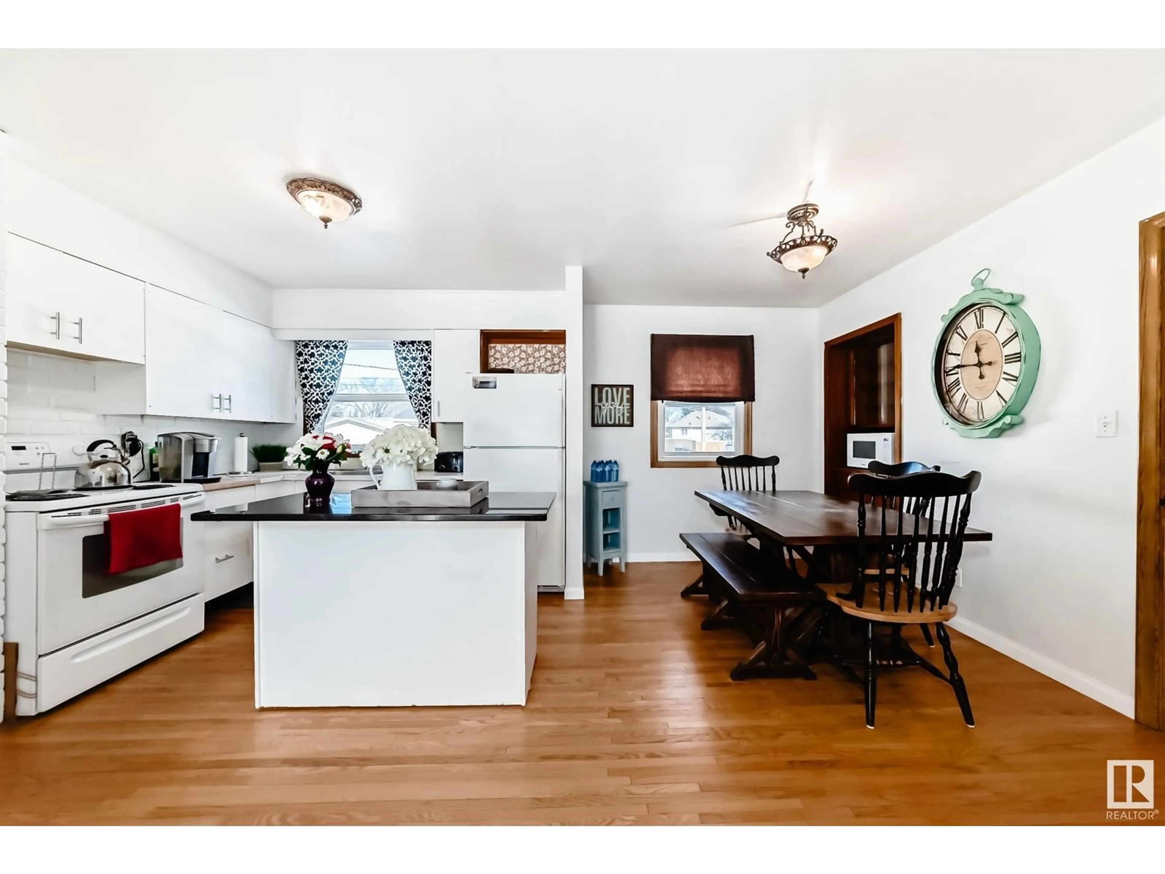 Open concept kitchen, wood/laminate floor for 4026 113 AV NW, Edmonton Alberta T5W0R3