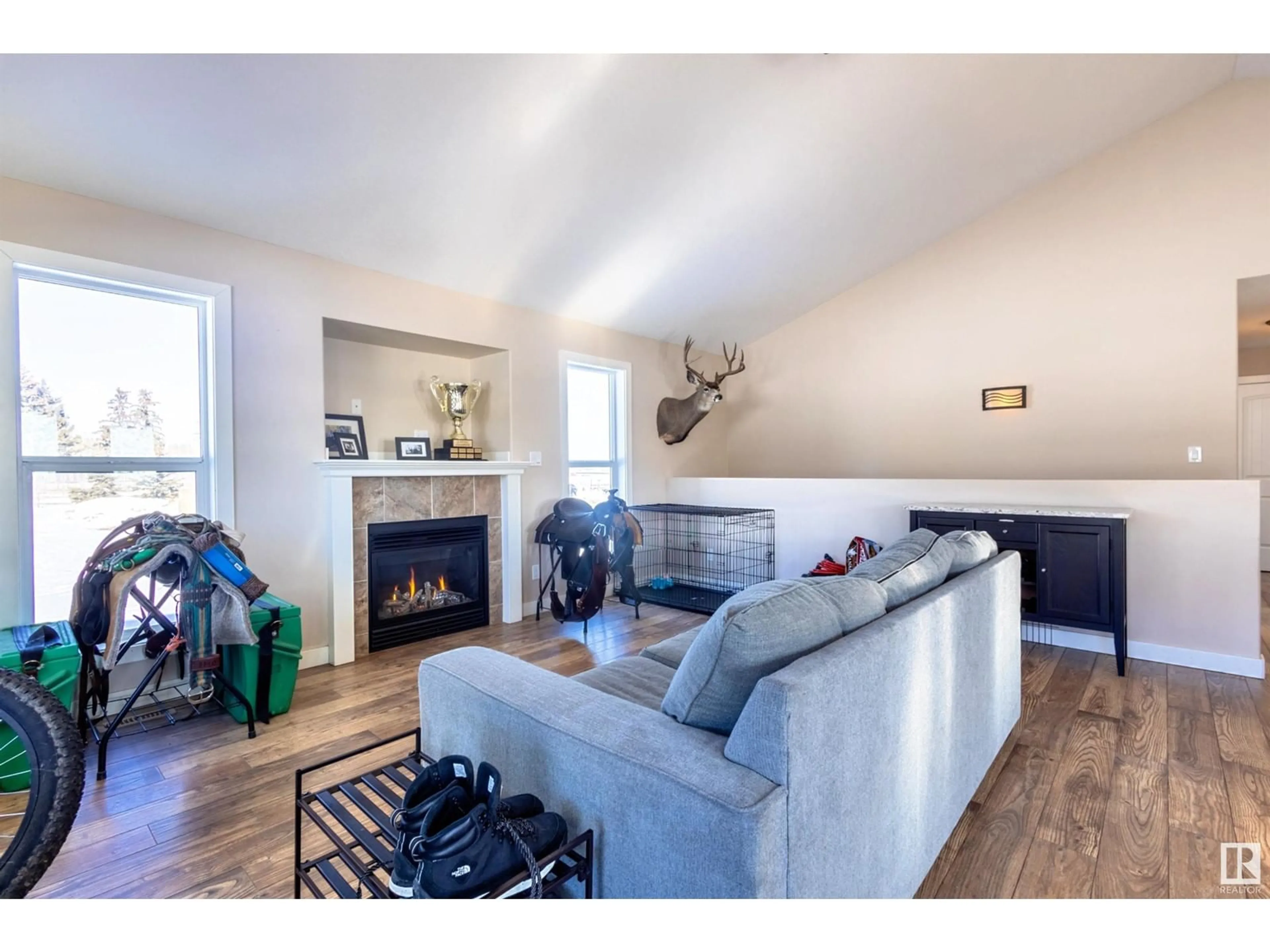 Living room with furniture, wood/laminate floor for 434045 RR 30, Rural Ponoka County Alberta T0C0M0