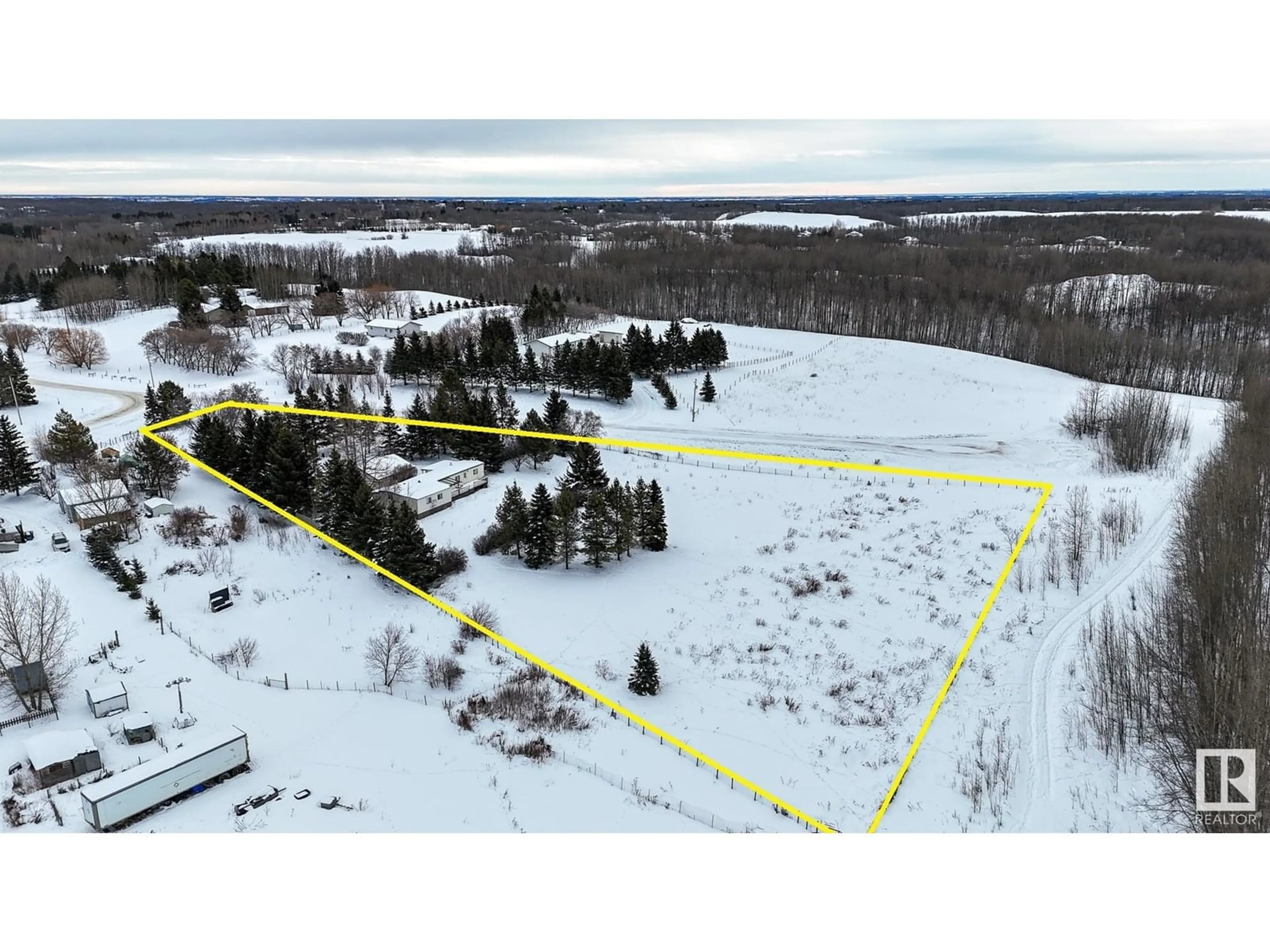 A pic from outside/outdoor area/front of a property/back of a property/a pic from drone, forest/trees view for #12 53504 RGE ROAD 14, Rural Parkland County Alberta T7Y0B5