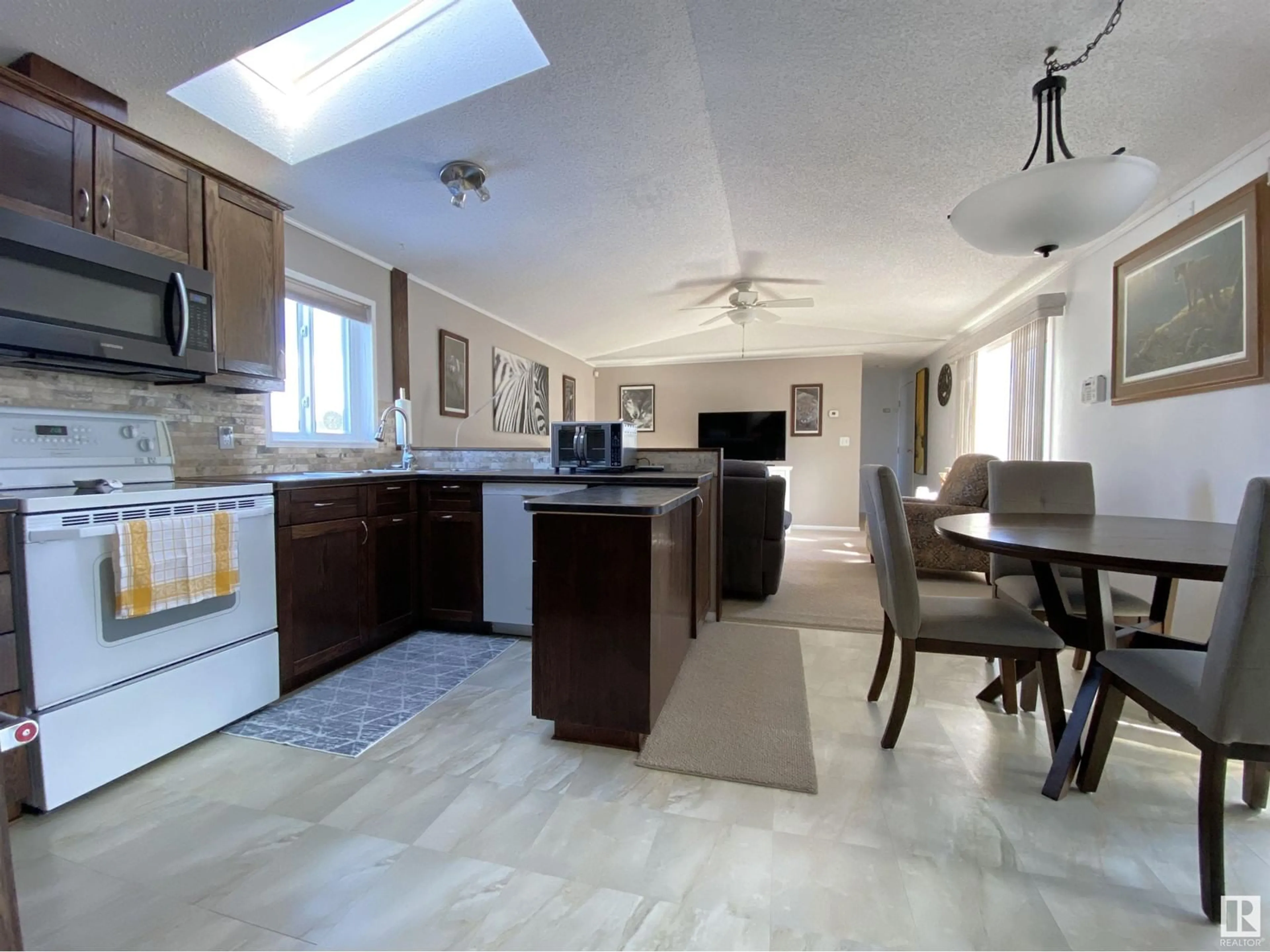 Open concept kitchen, ceramic/tile floor for #100 4819 51 AV, Millet Alberta T0C1Z0