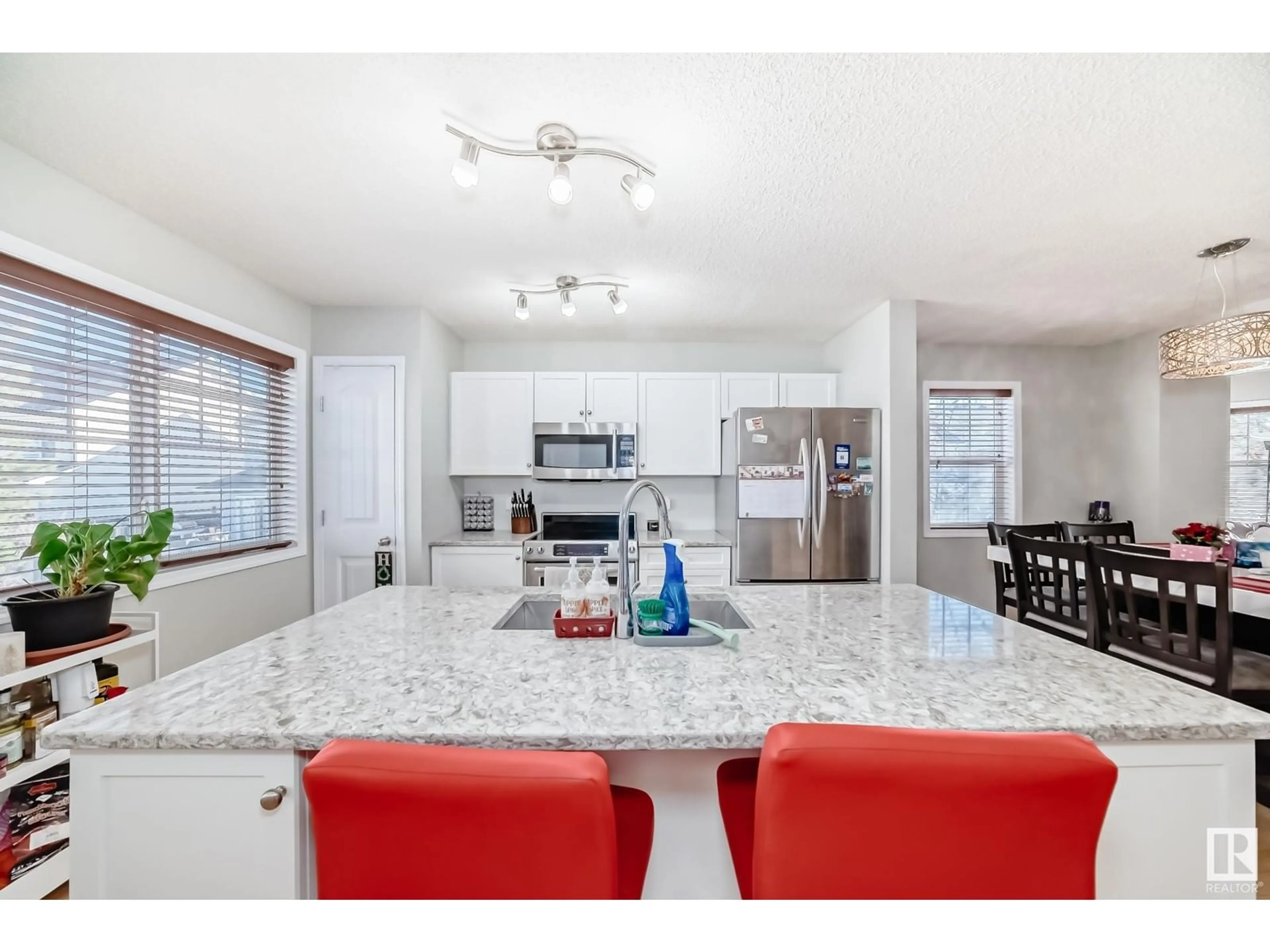 Open concept kitchen, ceramic/tile floor for #18 8304 11 AV SW, Edmonton Alberta T6X1J8