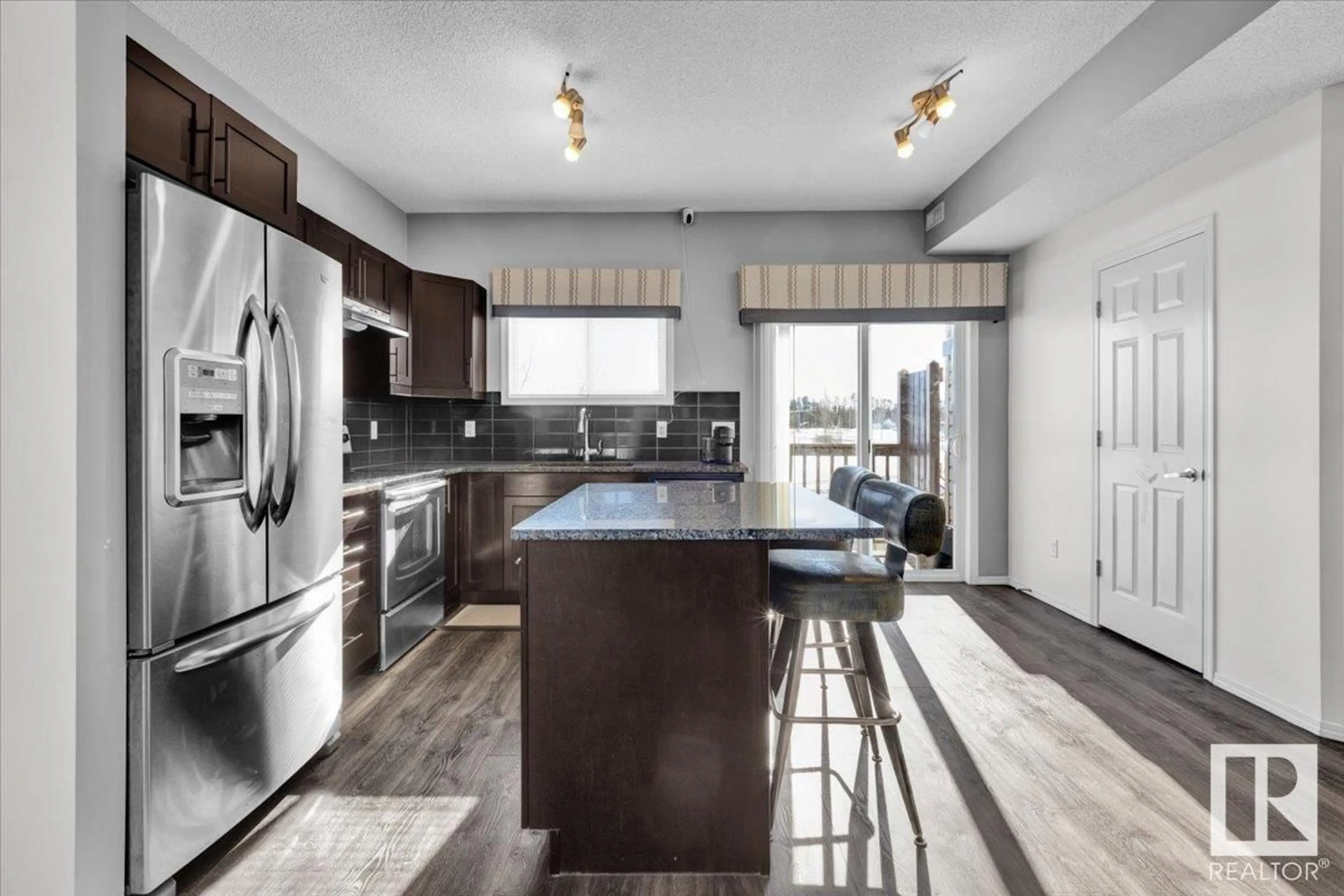 Open concept kitchen, unknown for #44 6520 2 AV SW, Edmonton Alberta T6X1S4