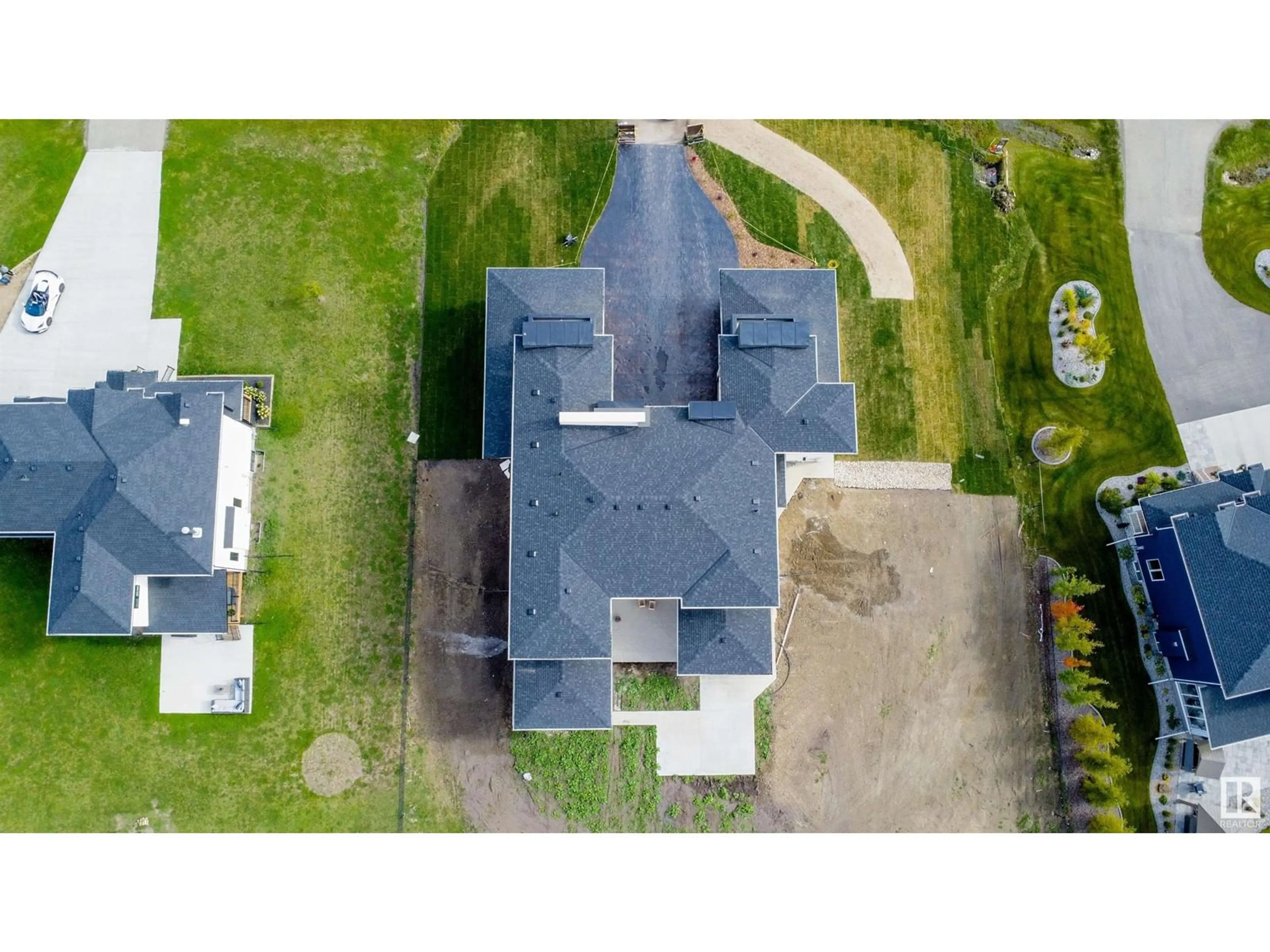 A pic from outside/outdoor area/front of a property/back of a property/a pic from drone, unknown for 48 26409 TWP RD 532a, Rural Parkland County Alberta T7X4M1