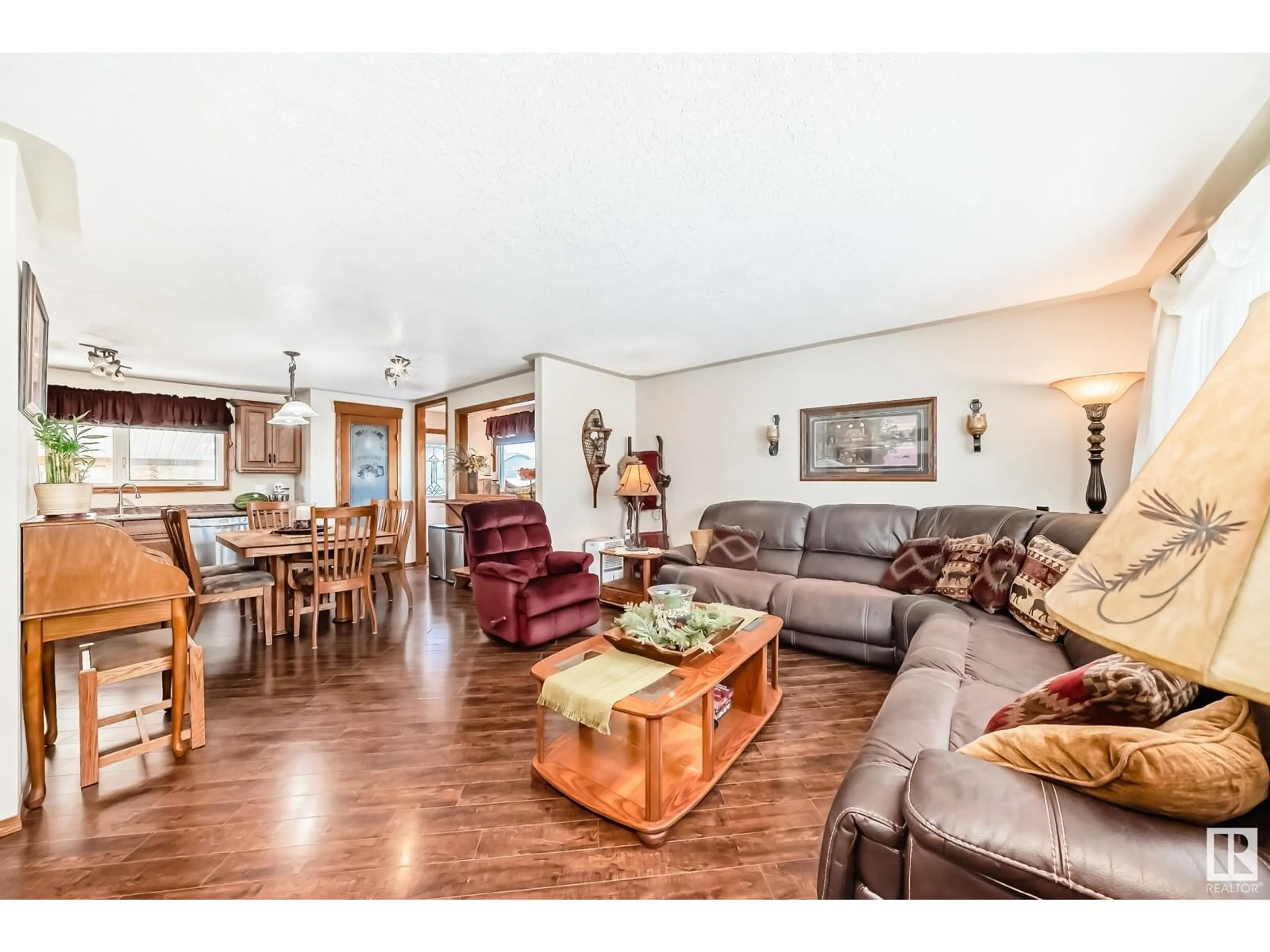 Living room with furniture, wood/laminate floor for 1947 151 AV NW, Edmonton Alberta T5Y1W1