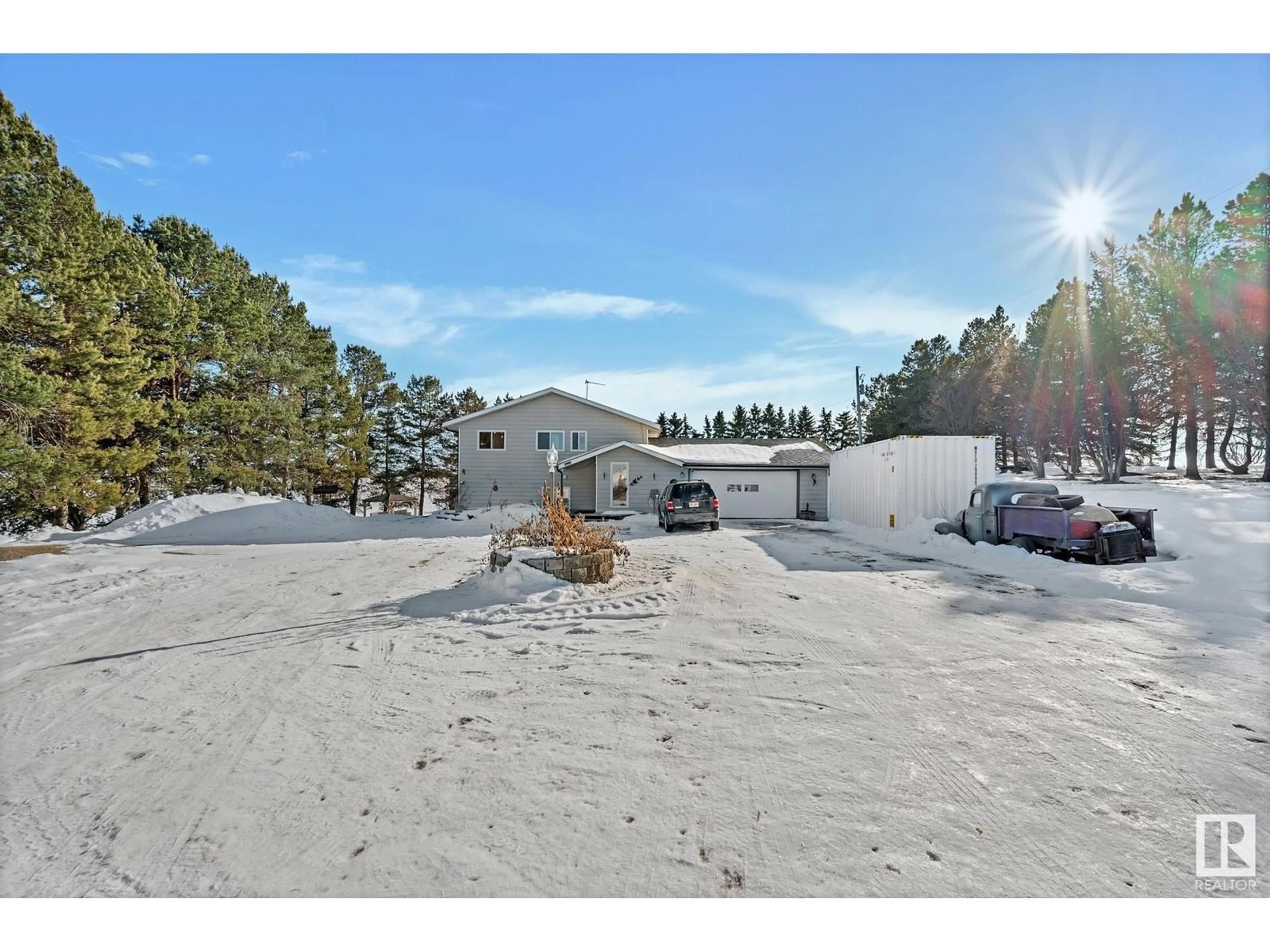 A pic from outside/outdoor area/front of a property/back of a property/a pic from drone, mountain view for 24405 TWP ROAD 582, Rural Sturgeon County Alberta T0G1L0