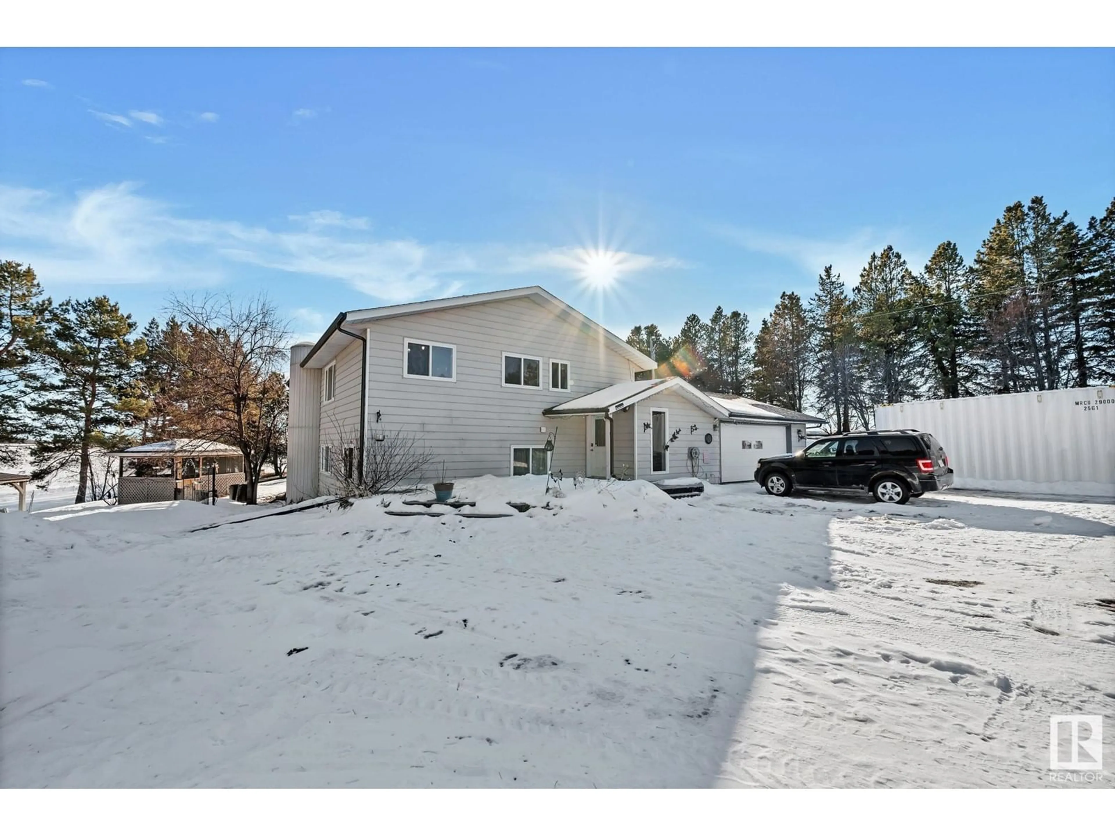 A pic from outside/outdoor area/front of a property/back of a property/a pic from drone, mountain view for 24405 TWP ROAD 582, Rural Sturgeon County Alberta T0G1L0