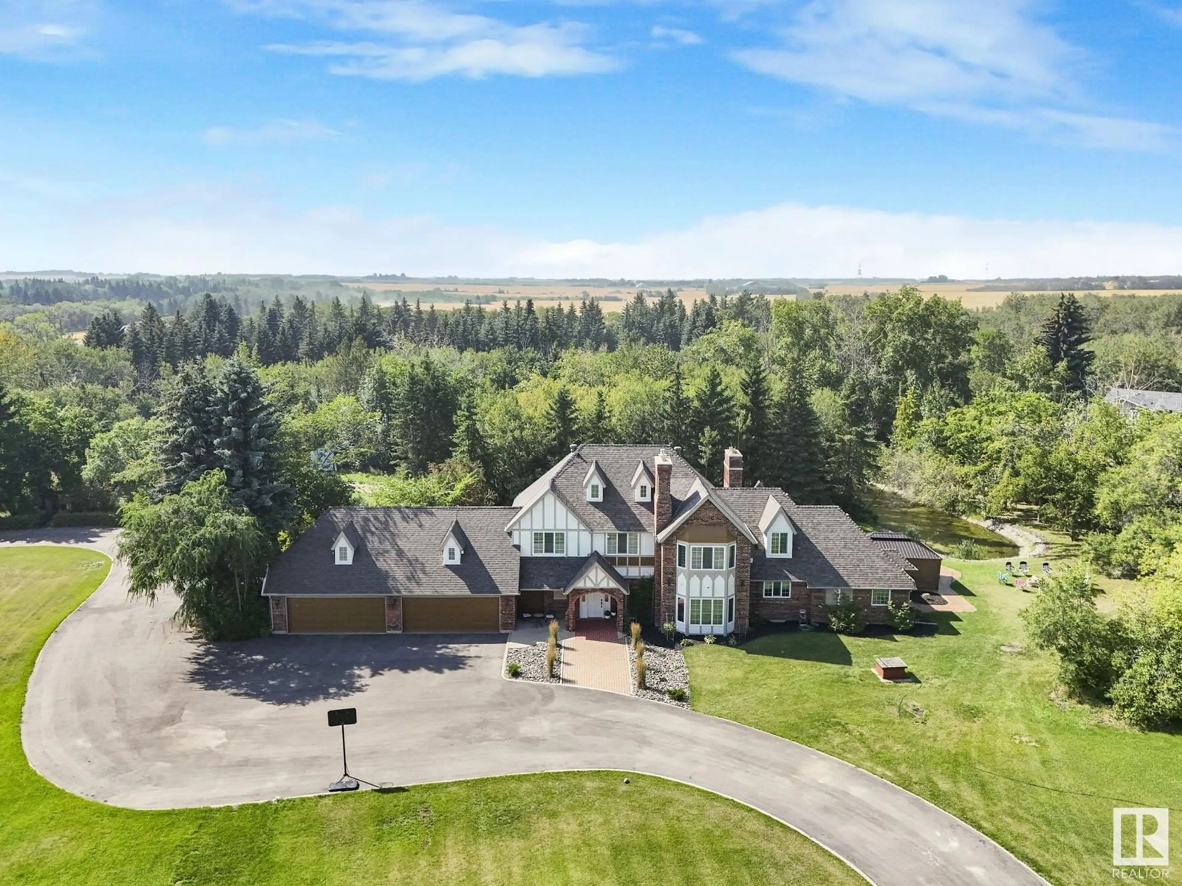 A pic from outside/outdoor area/front of a property/back of a property/a pic from drone, mountain view for 5 54509 RGE RD 232, Rural Sturgeon County Alberta T8L5E9