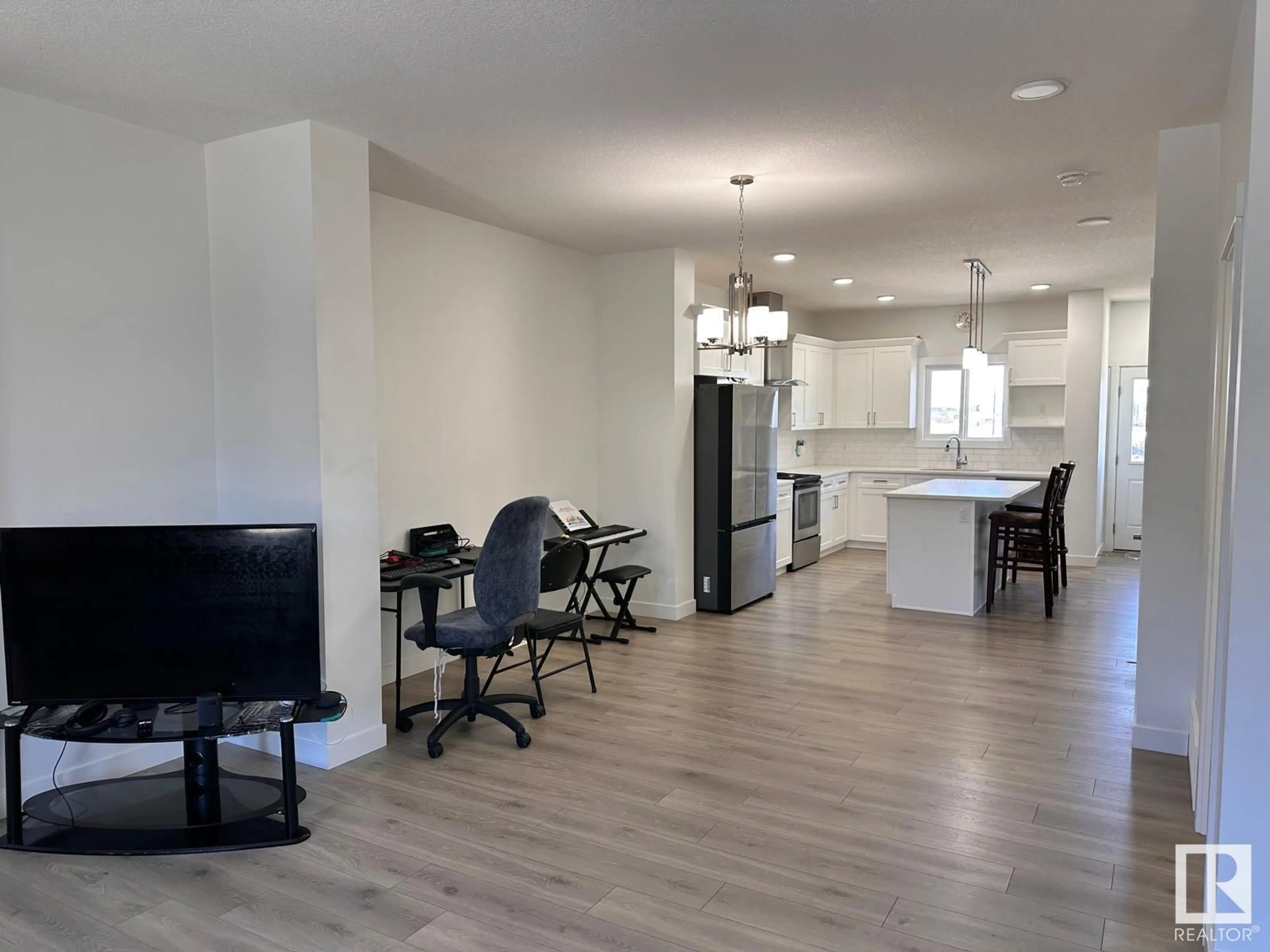 Open concept kitchen, wood/laminate floor for 436 29 ST SW, Edmonton Alberta T6X3E7