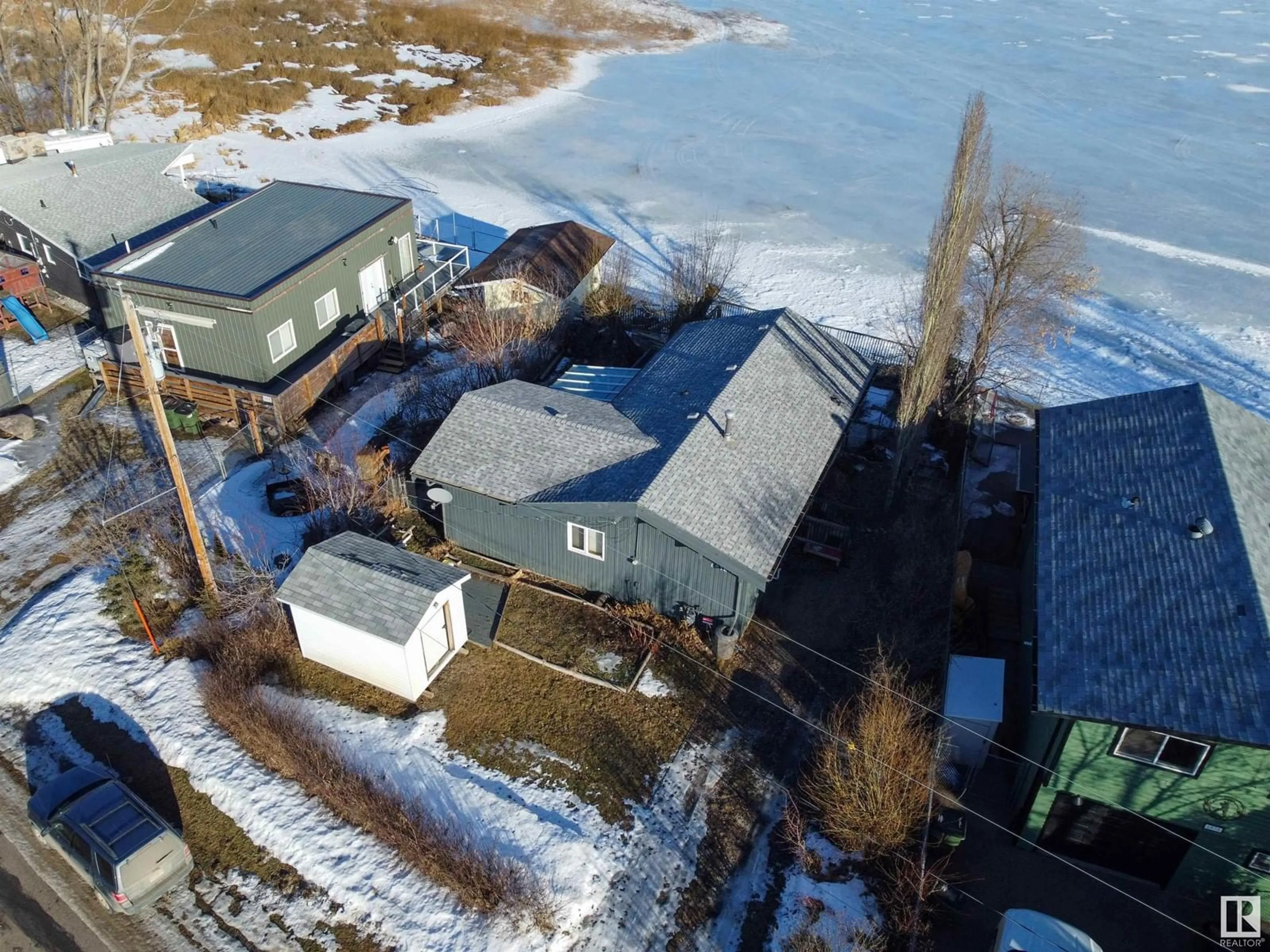 A pic from outside/outdoor area/front of a property/back of a property/a pic from drone, water/lake/river/ocean view for 6818 50 AV, Rural Lac Ste. Anne County Alberta T0E0A0