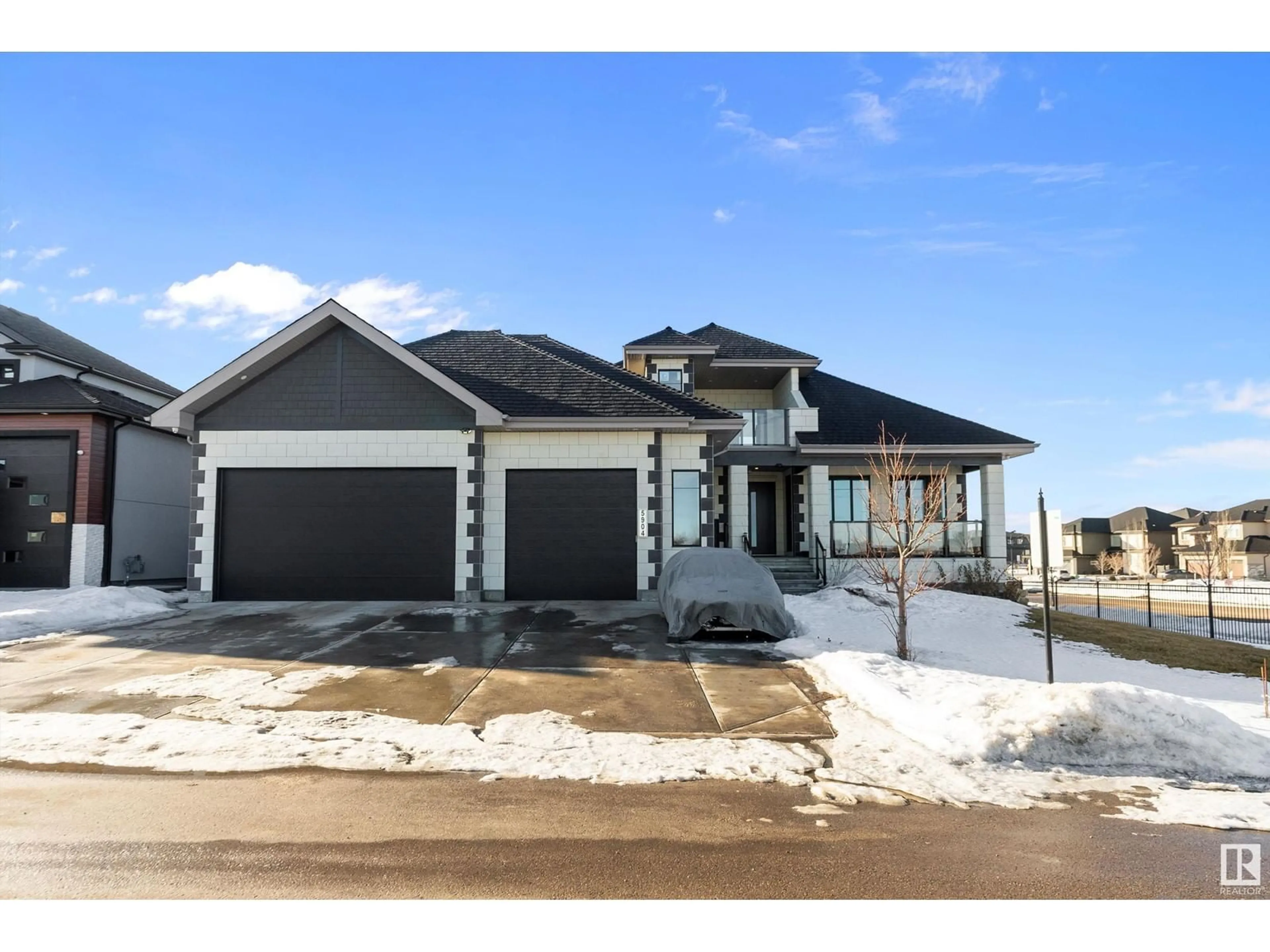 Home with brick exterior material, street for NE - 5904 32 ST, Rural Leduc County Alberta T4X0X4