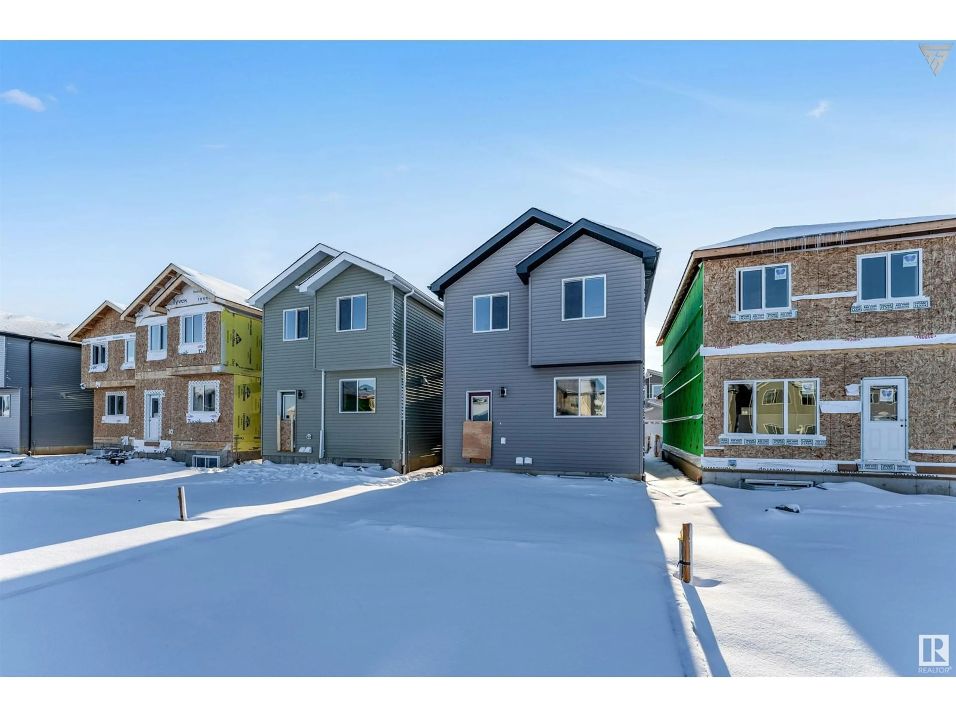Home with vinyl exterior material, street for 1224 14 AV, Edmonton Alberta T6T2W2