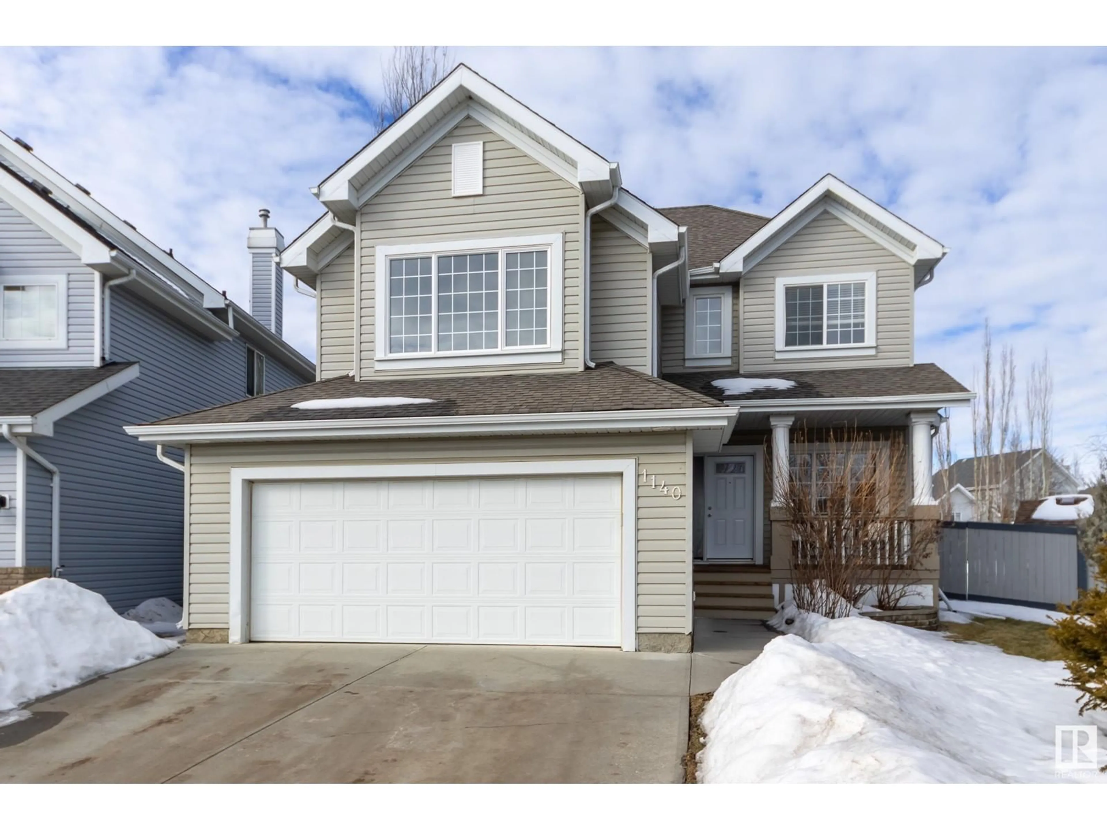 Home with vinyl exterior material, street for 1140 SUMMERSIDE DR SW, Edmonton Alberta T6X1C6