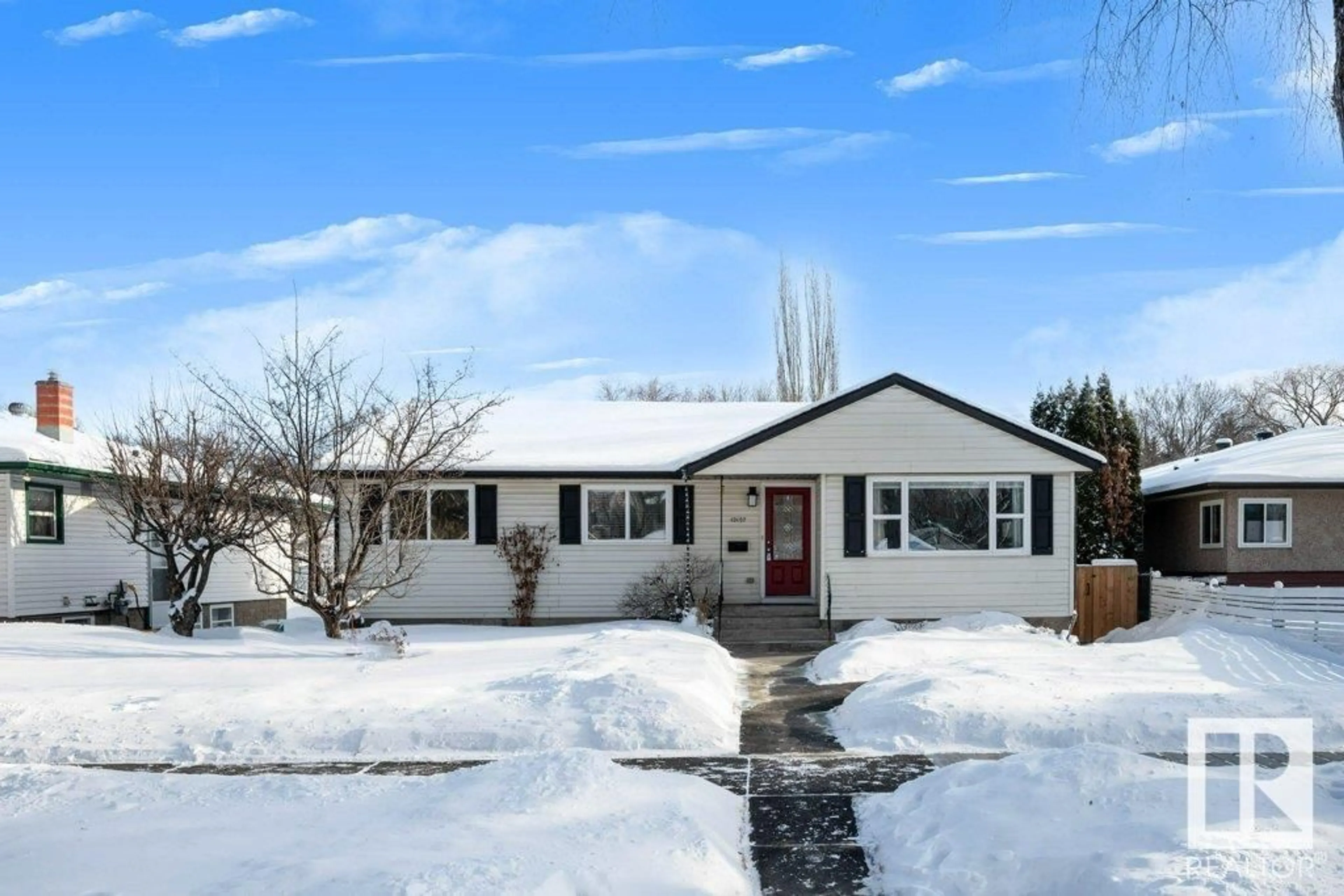 Home with vinyl exterior material, street for 10107 82 ST NW NW, Edmonton Alberta T6A3M1