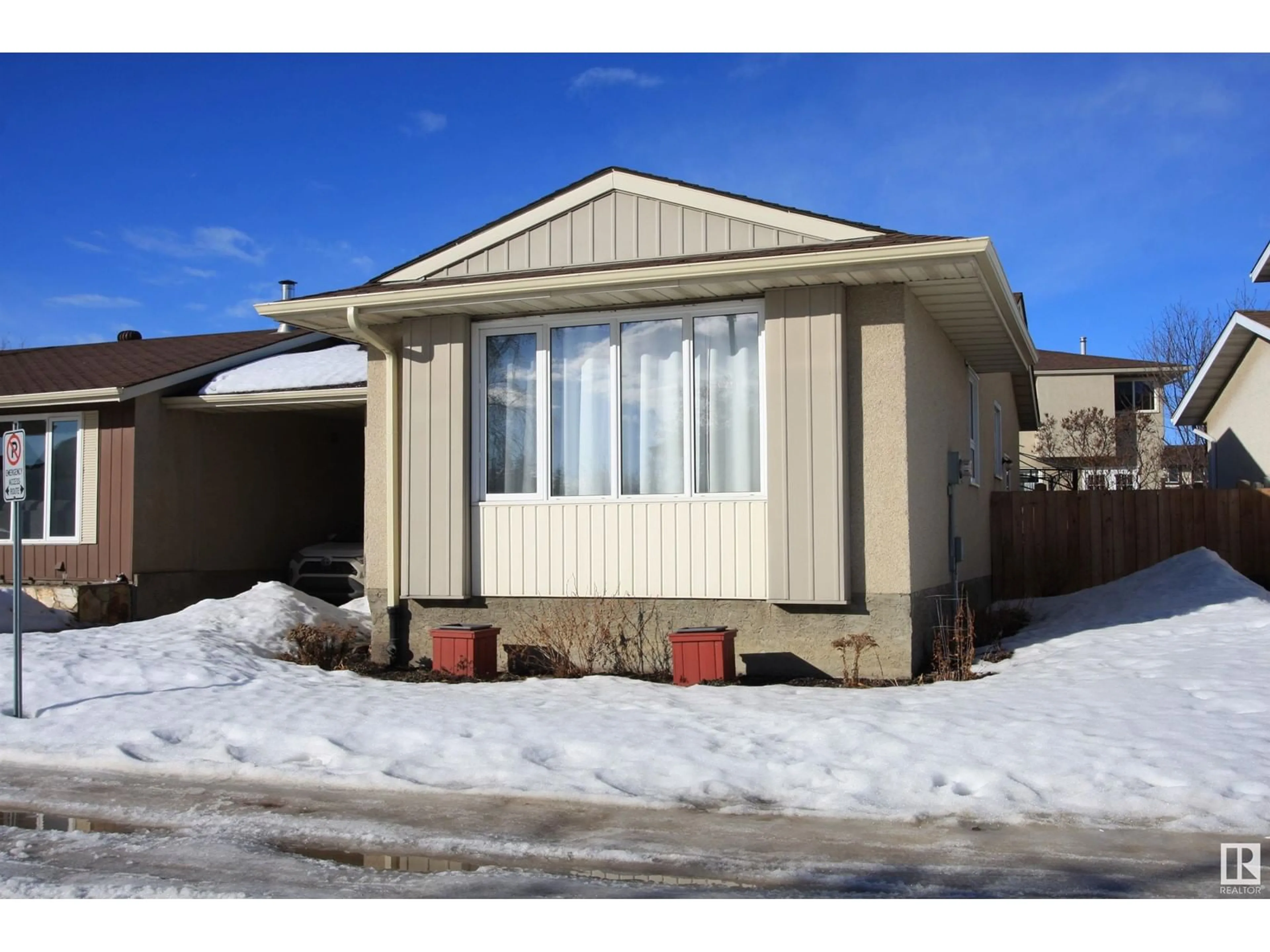 Home with vinyl exterior material, street for 13831 114 ST NW, Edmonton Alberta T5X4A1