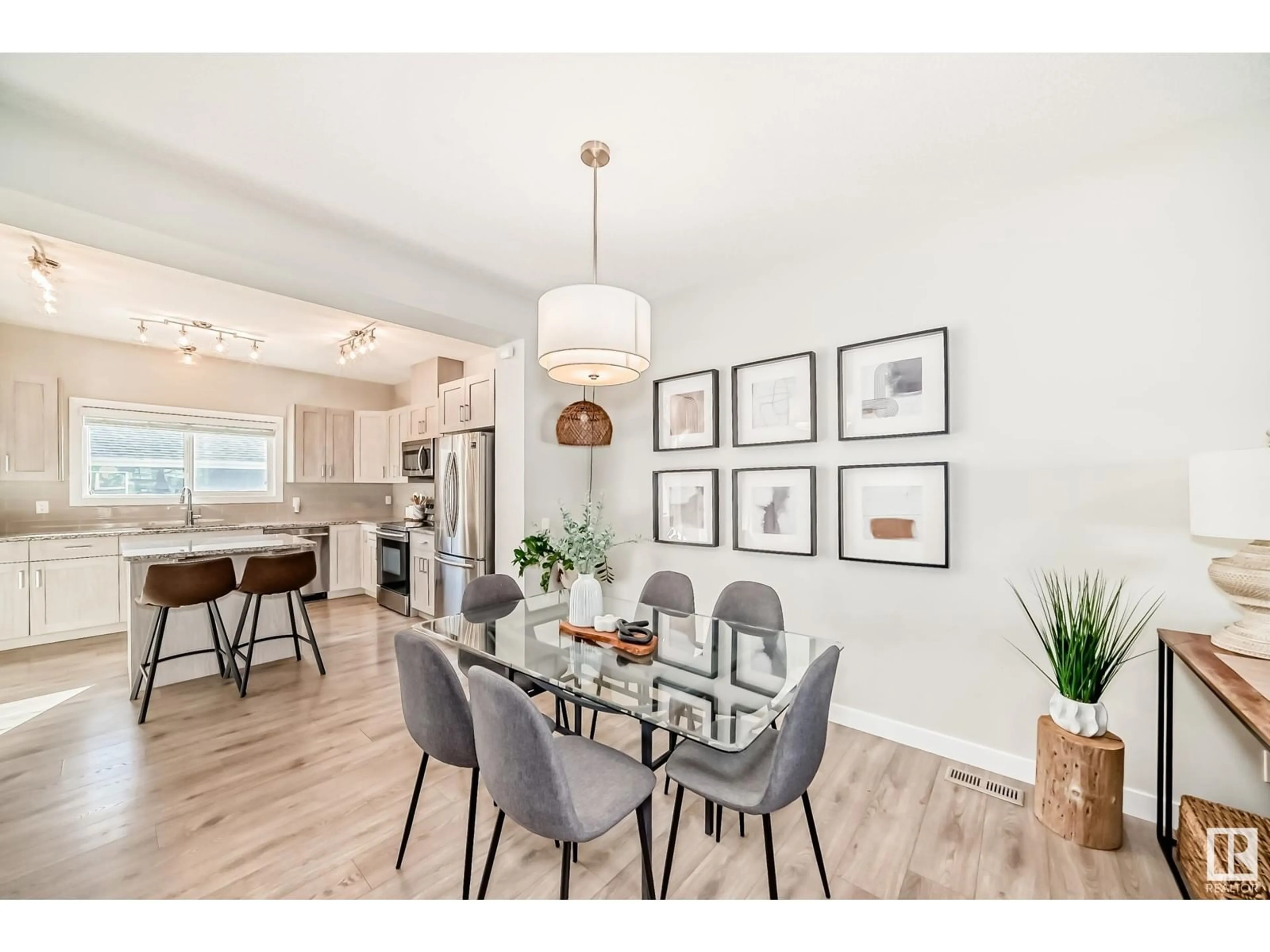 Dining room, wood/laminate floor for 8013 ORCHARDS GREEN GR SW, Edmonton Alberta T6X2L4