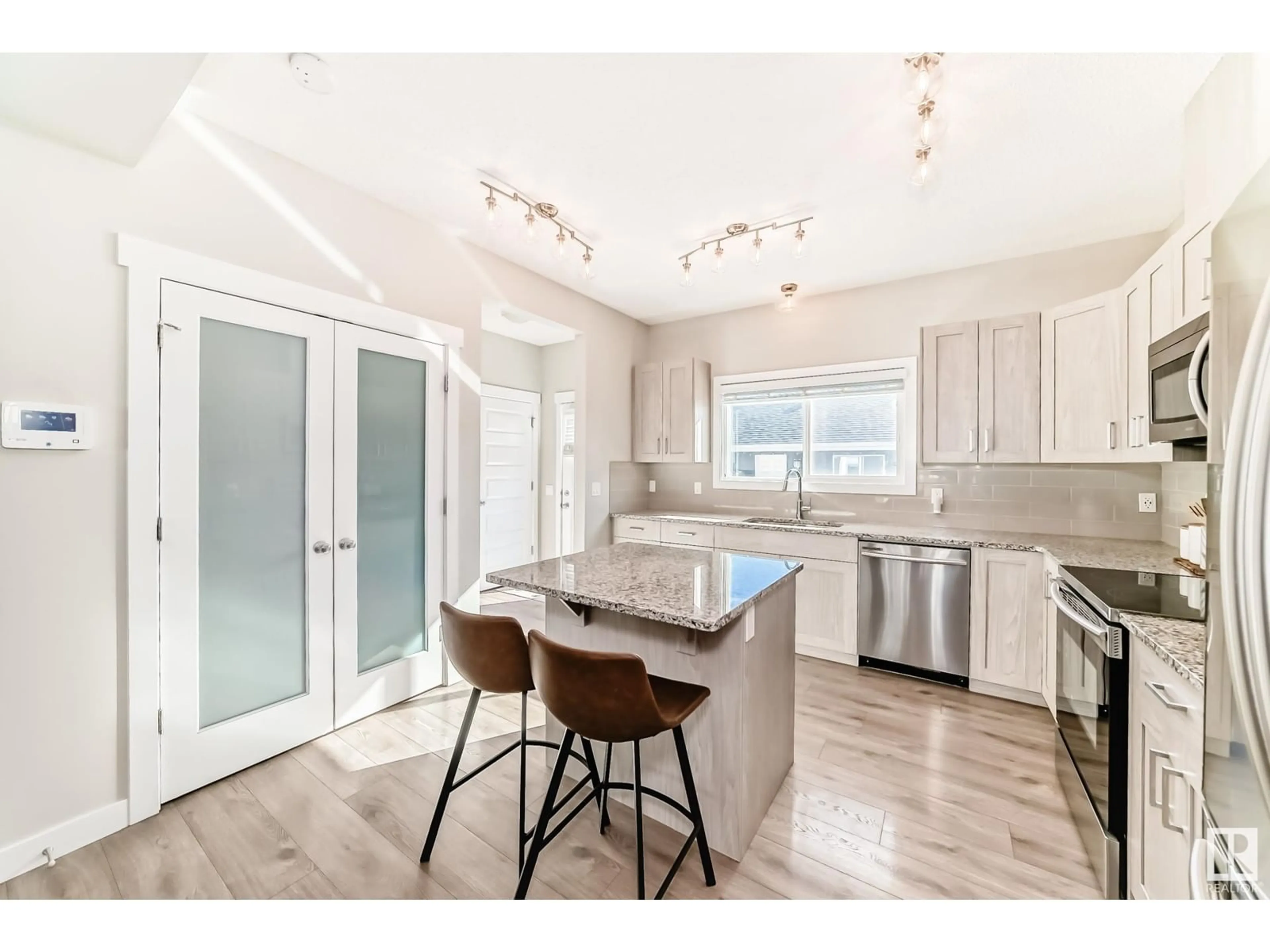 Open concept kitchen, unknown for 8013 ORCHARDS GREEN GR SW, Edmonton Alberta T6X2L4