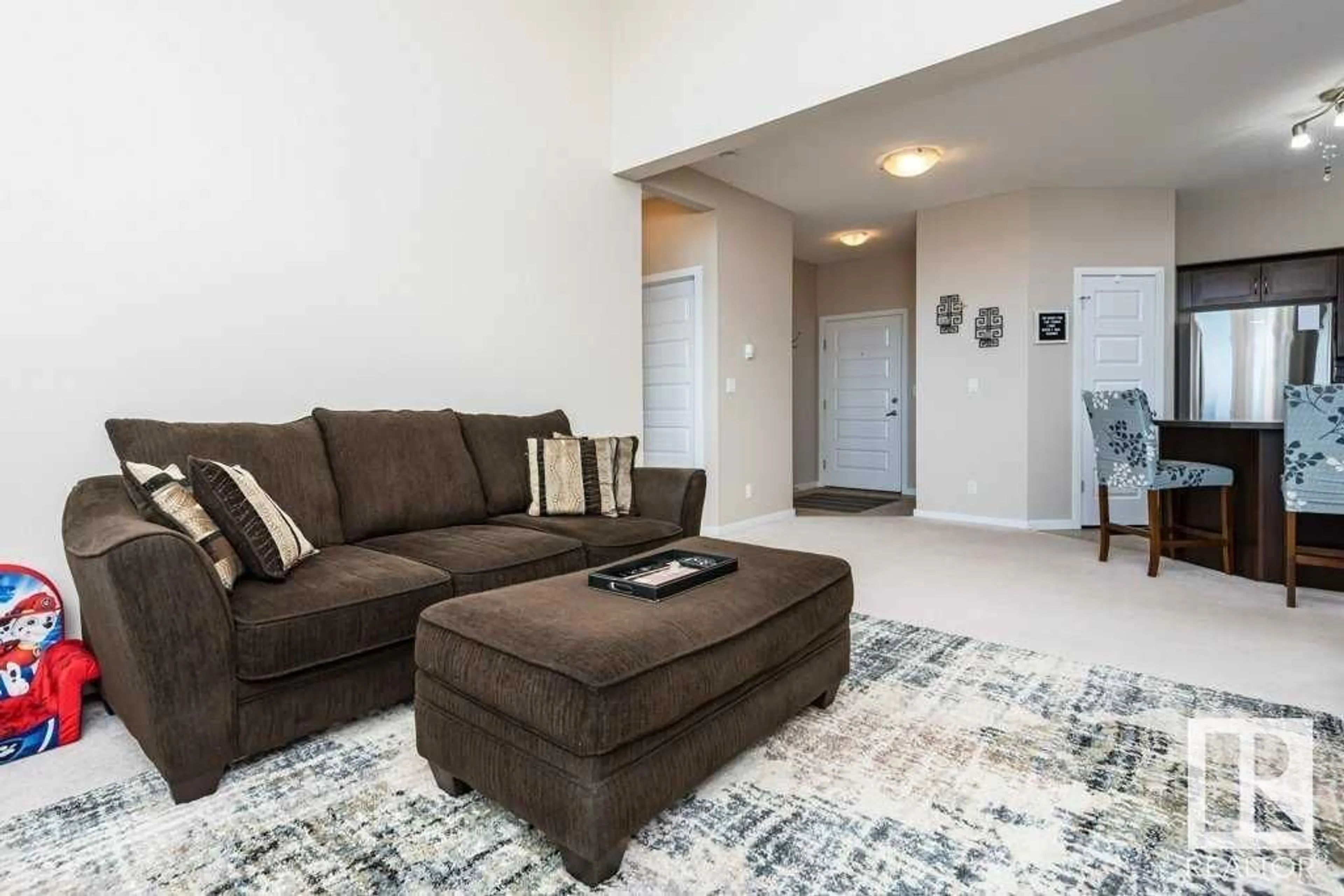 Living room with furniture, carpet floor for #415 400 Silver Berry RD NW, Edmonton Alberta T6T0H1