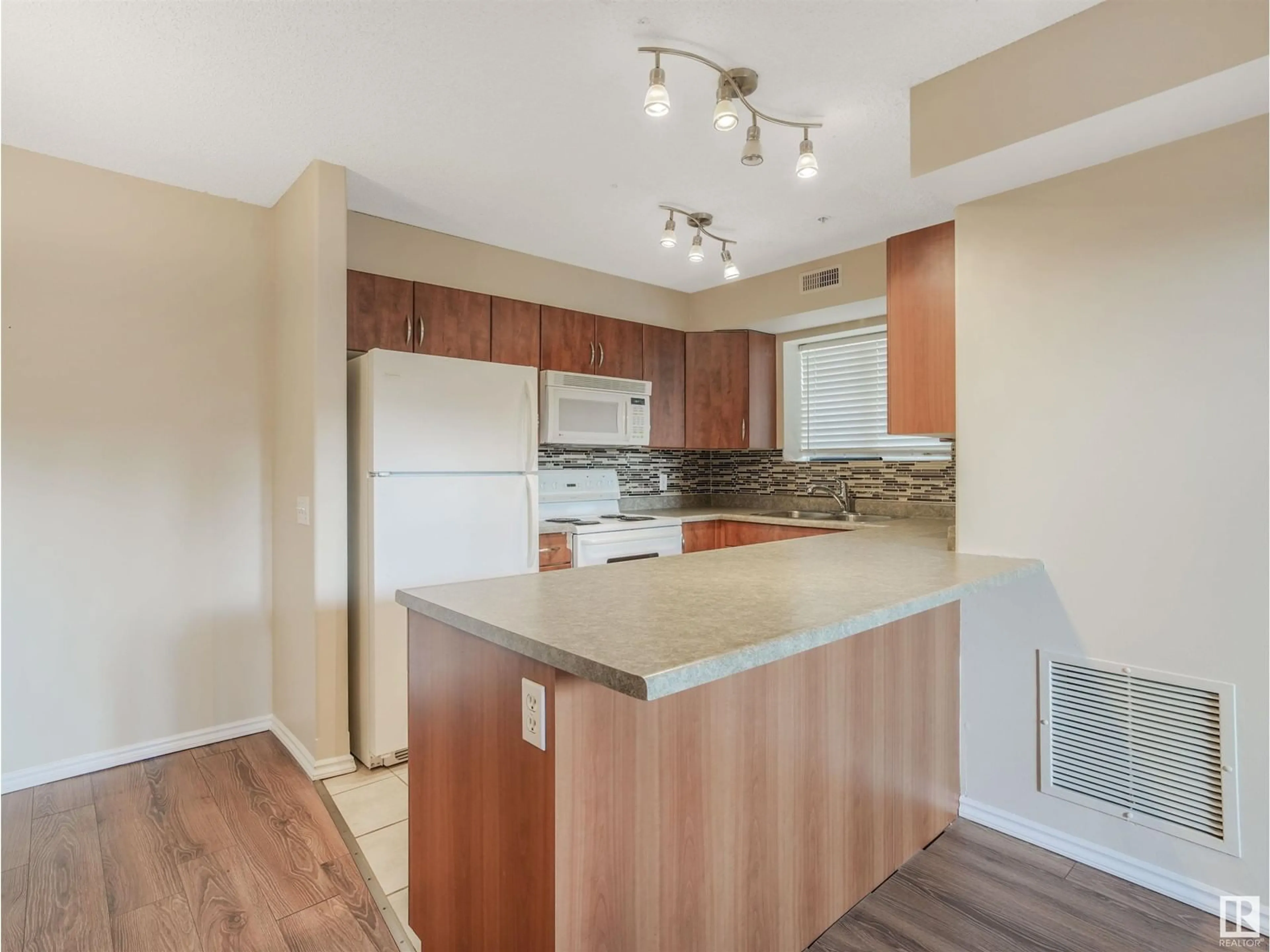 Standard kitchen, wood/laminate floor for #101 10528 77 AV NW, Edmonton Alberta T6E1N1