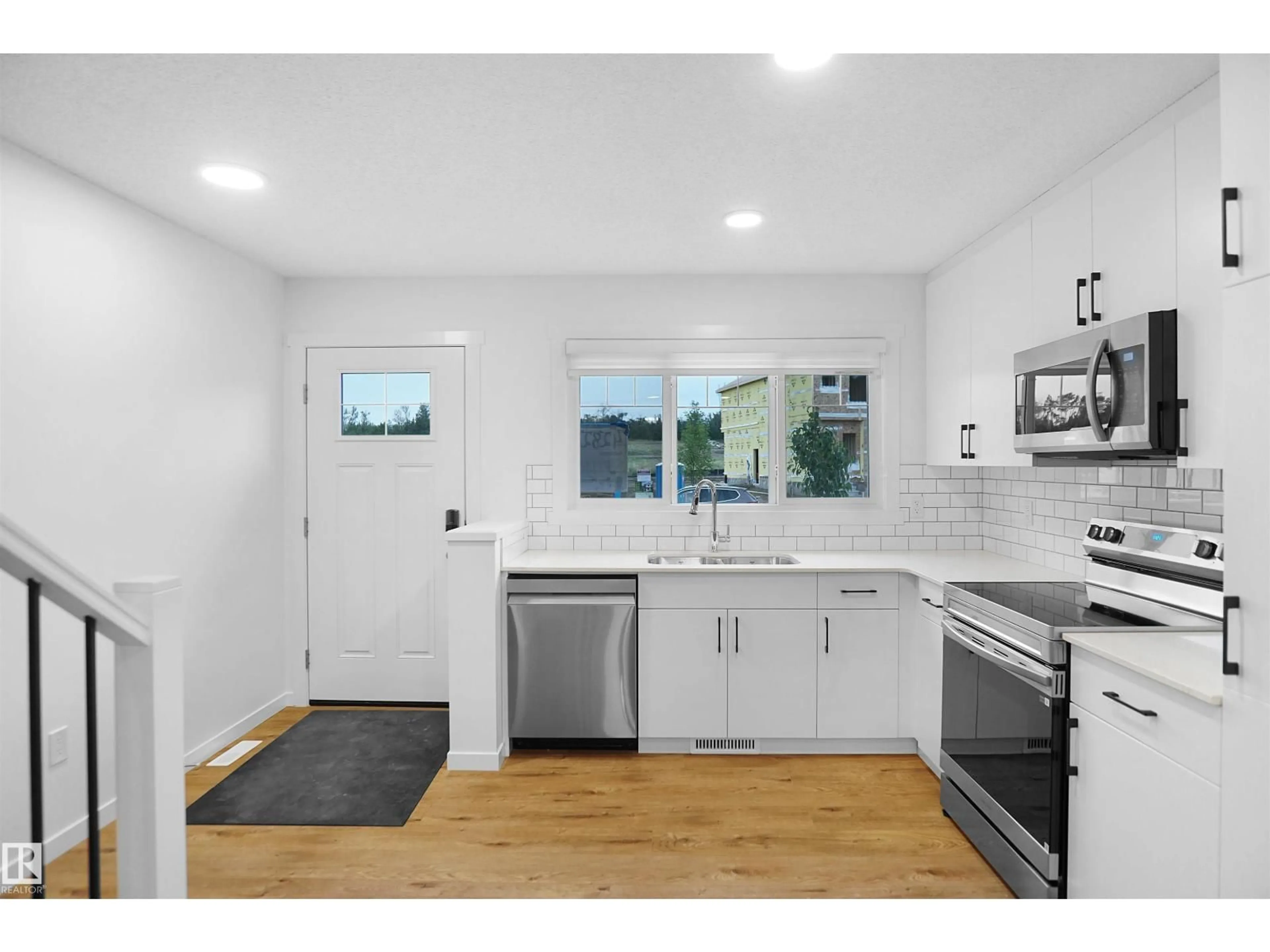 Open concept kitchen, unknown for NW - 2027 210 ST, Edmonton Alberta T6M2P5