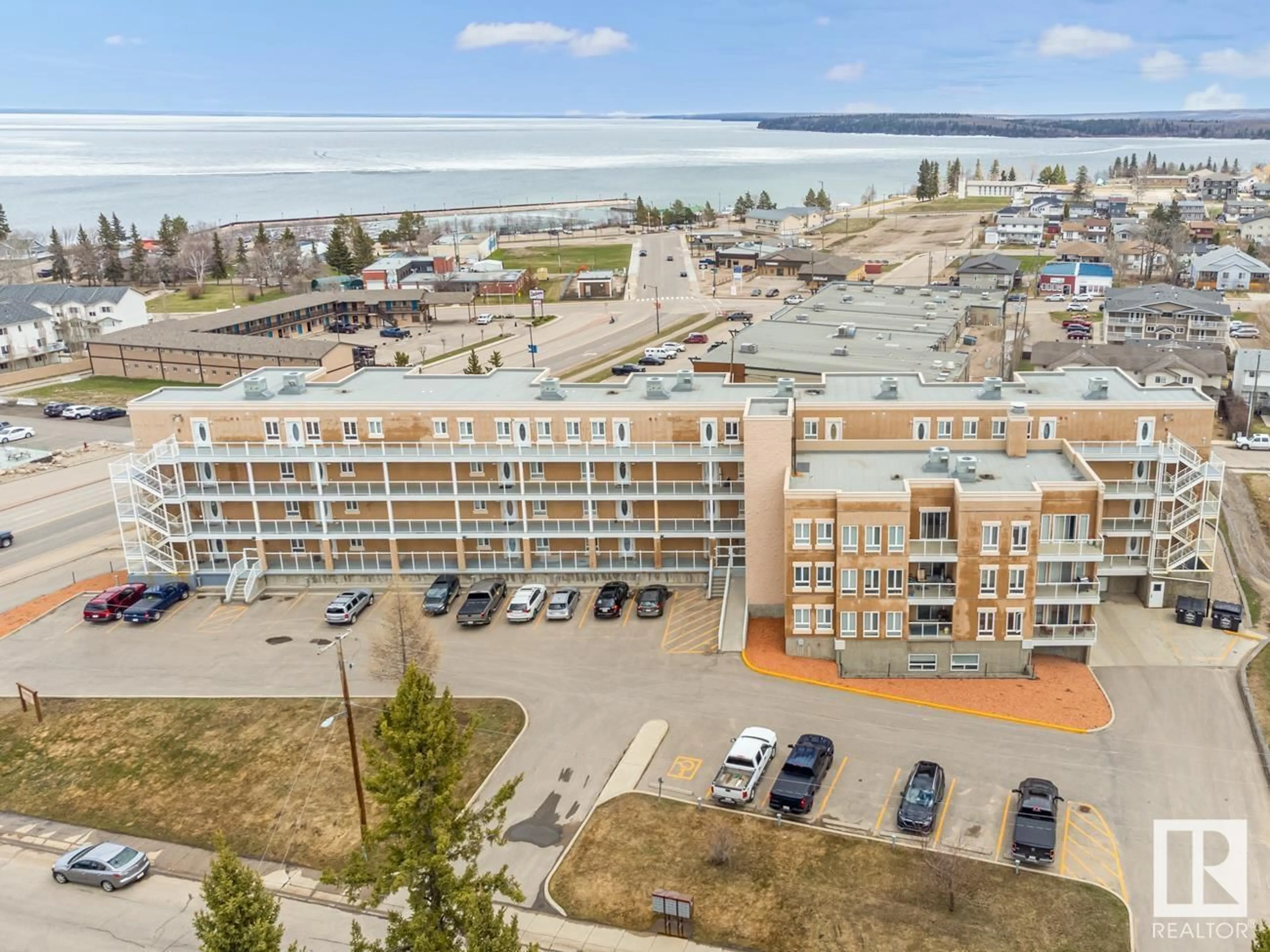 A pic from outside/outdoor area/front of a property/back of a property/a pic from drone, water/lake/river/ocean view for #208 802 12 ST, Cold Lake Alberta T9M0A7