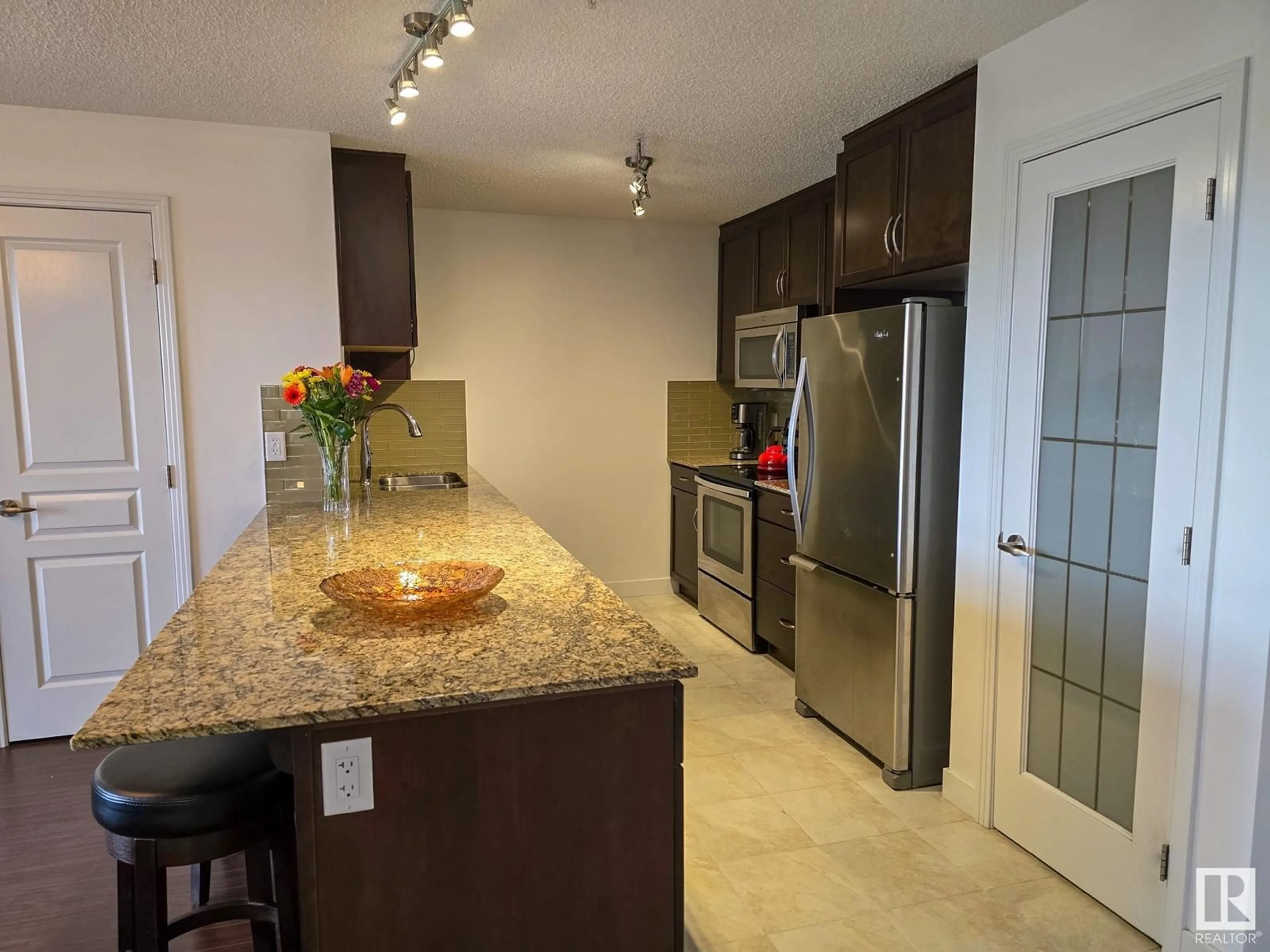 Open concept kitchen, ceramic/tile floor for #308 7021 SOUTH TERWILLEGAR DR NW, Edmonton Alberta T6R0W5