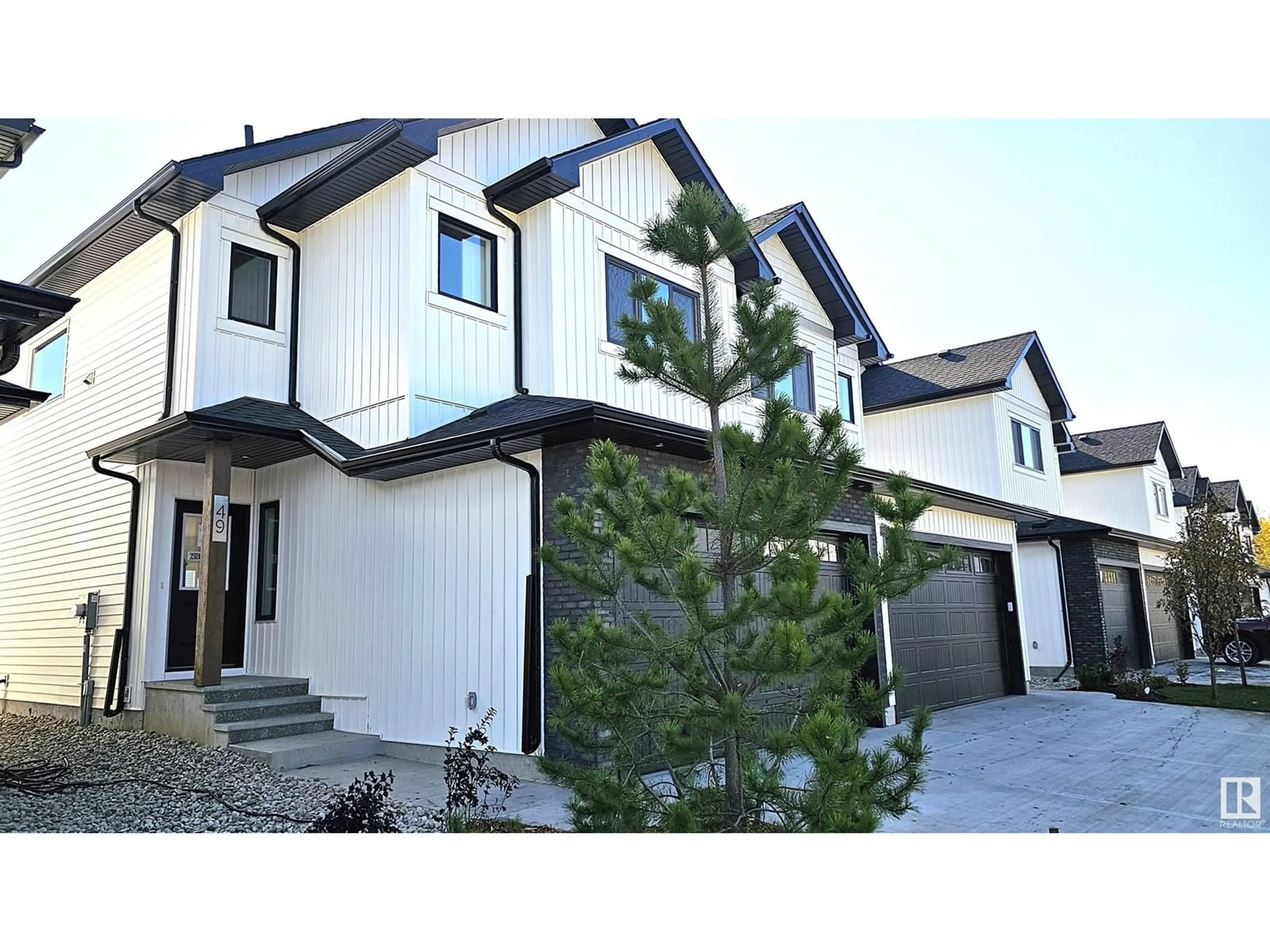 Home with vinyl exterior material, street for 49 - 5122 213A ST NW, Edmonton Alberta T6M1M6