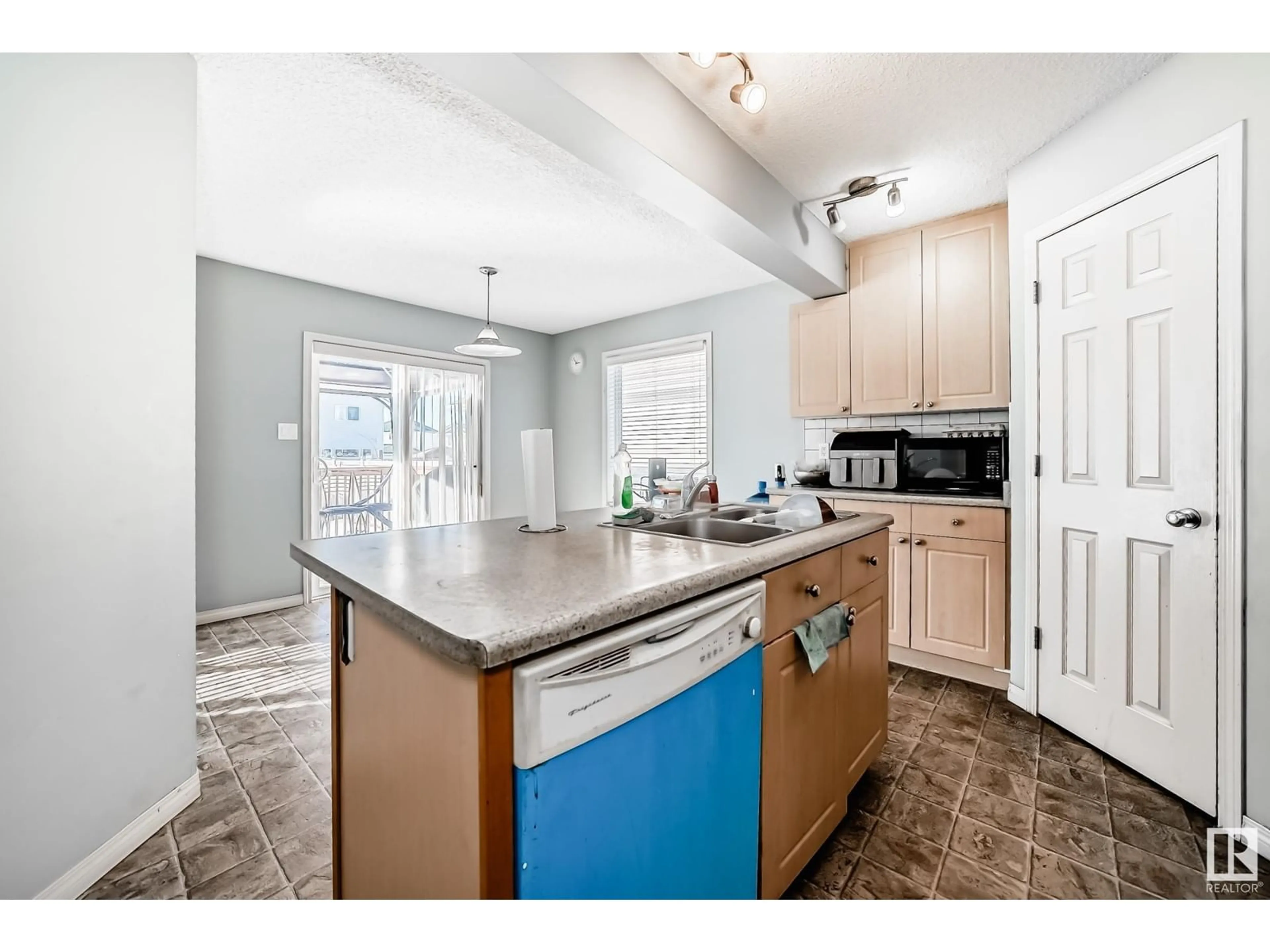 Open concept kitchen, ceramic/tile floor for 3320 20 ST NW, Edmonton Alberta T6T0L5