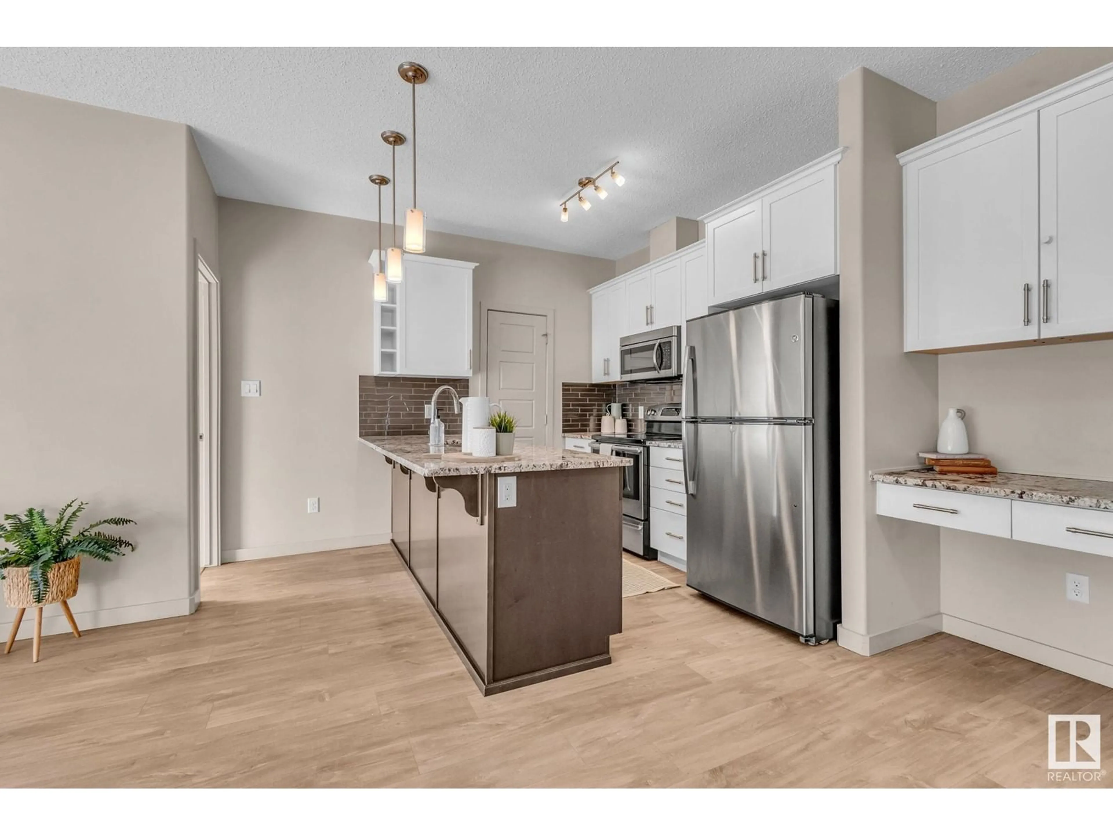 Open concept kitchen, unknown for #105 320 AMBLESIDE LINK LI SW, Edmonton Alberta T6W2Z9