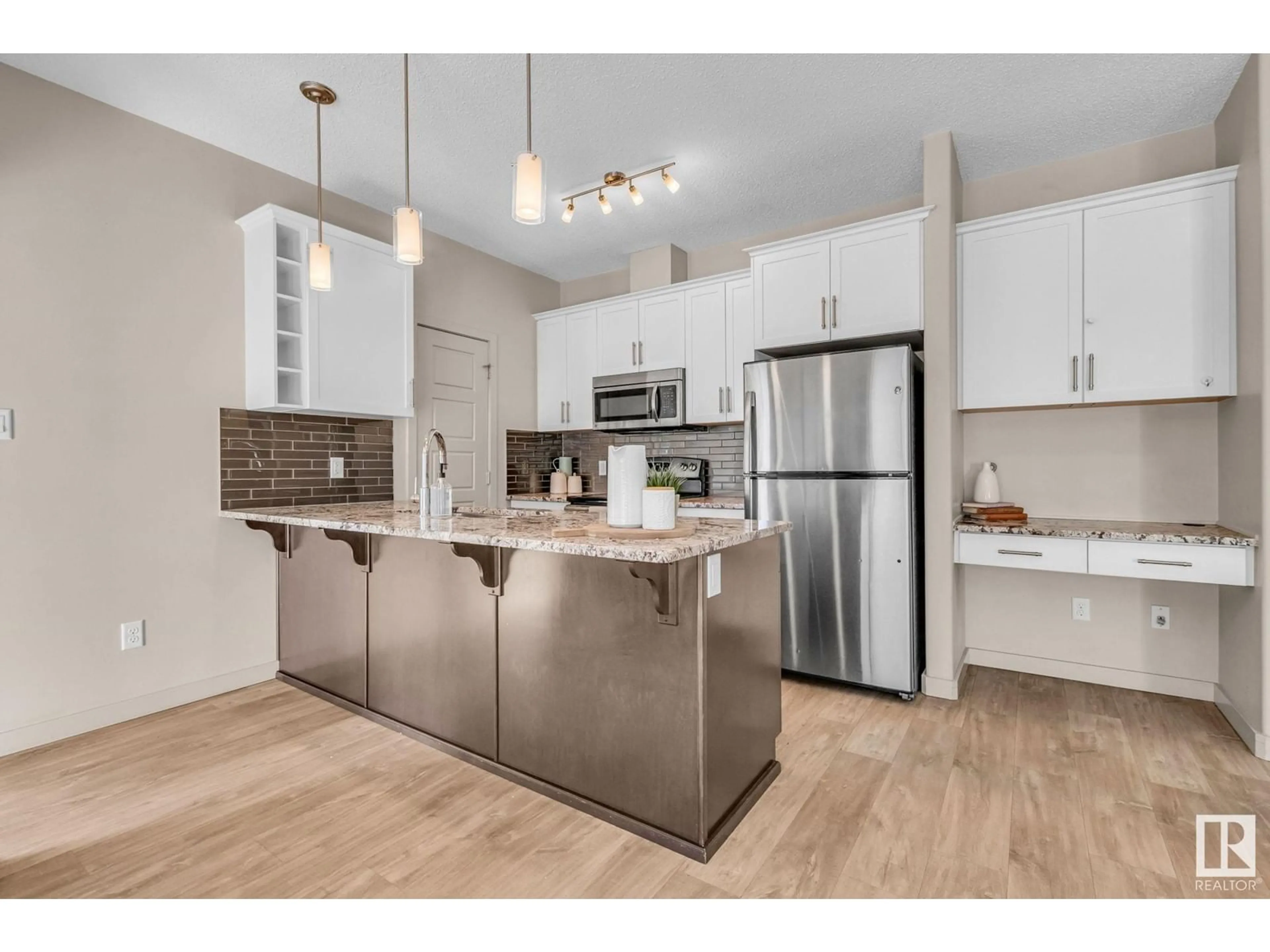 Open concept kitchen, unknown for #105 320 AMBLESIDE LINK LI SW, Edmonton Alberta T6W2Z9