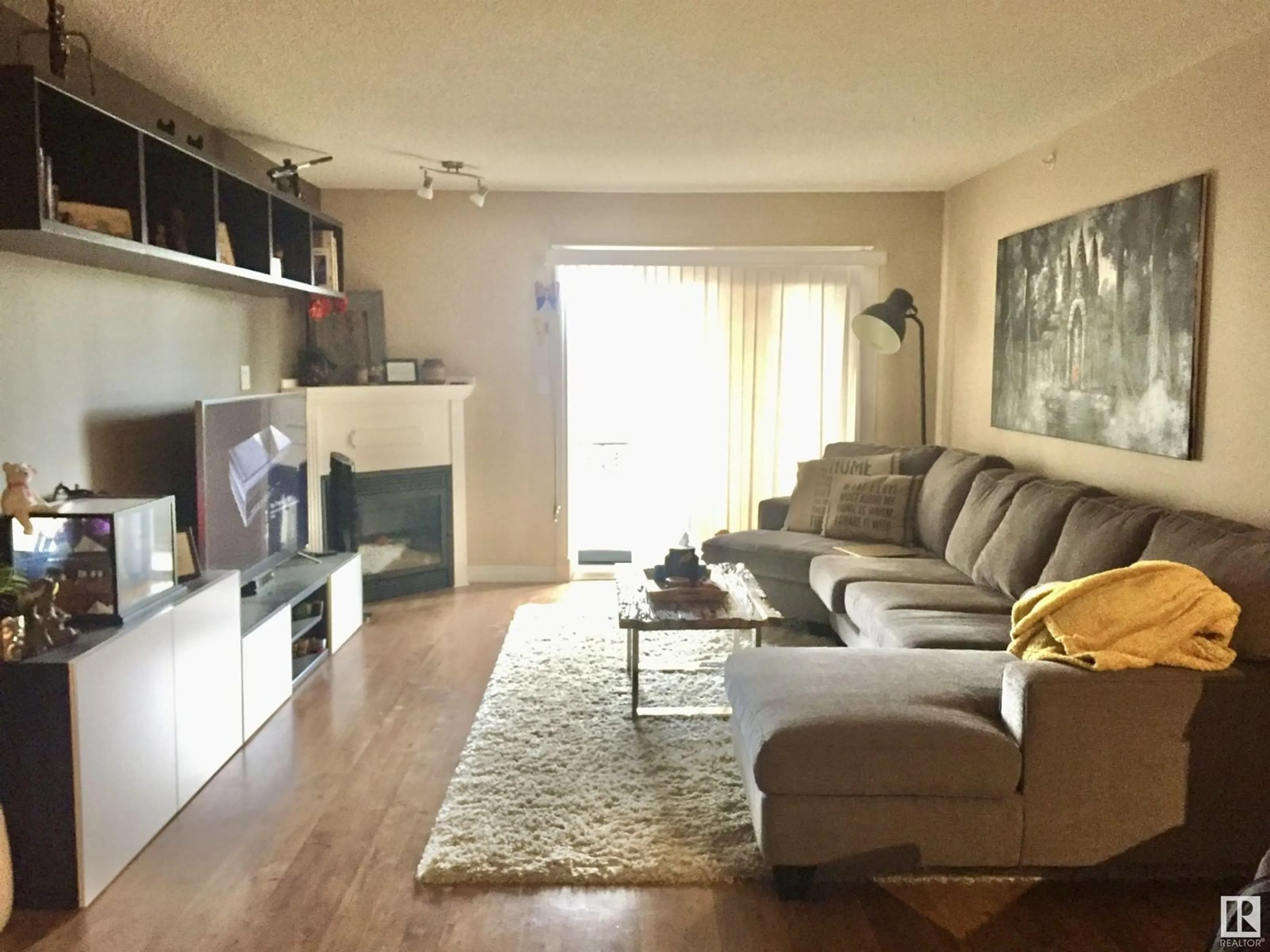 Living room with furniture, wood/laminate floor for #410B 6 SPRUCE RIDGE DR, Spruce Grove Alberta T7X4P4