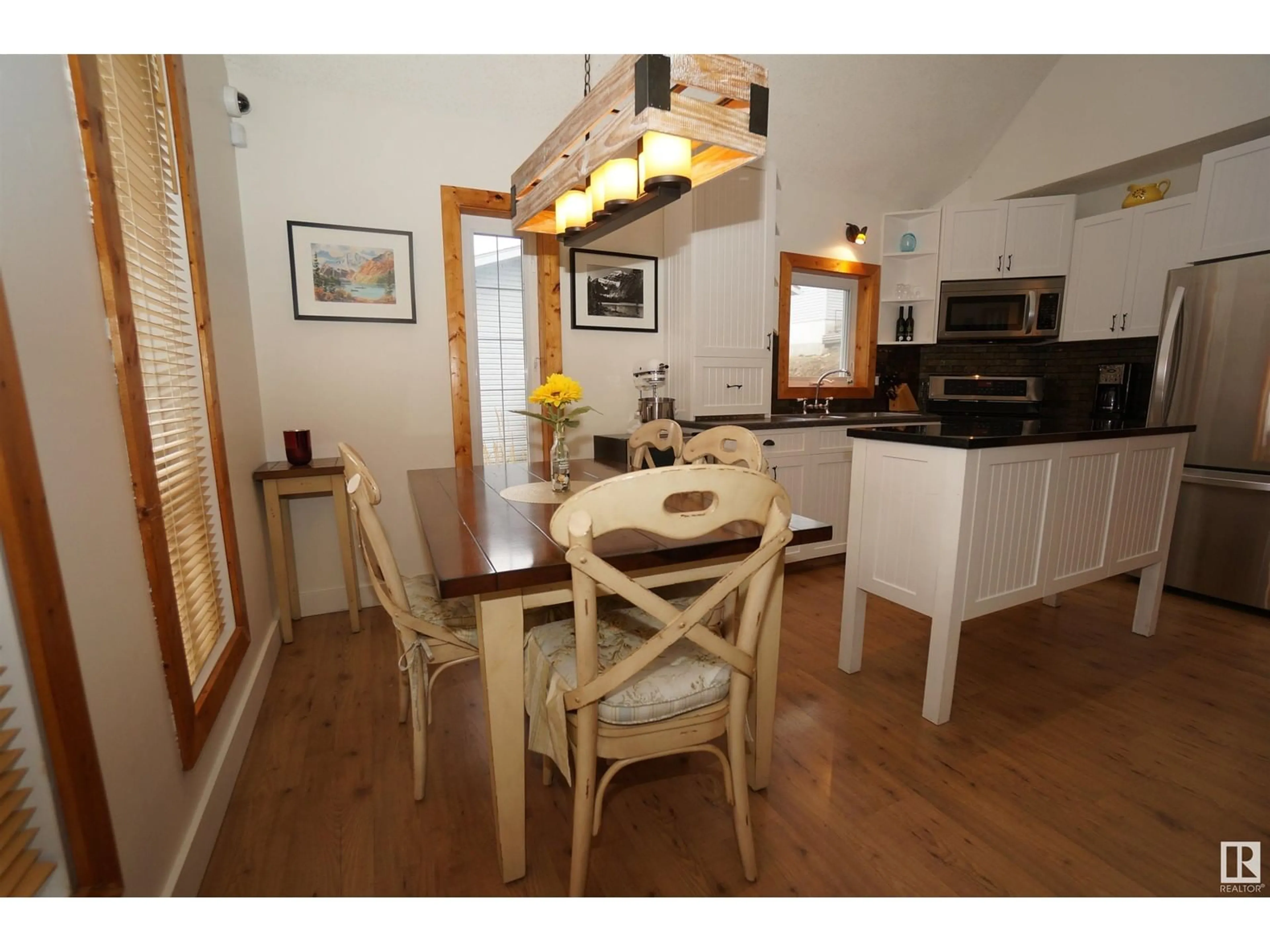 Dining room, wood/laminate floor for 214 Oscar Wikstrom DR, Rural Lac Ste. Anne County Alberta T0E0L0