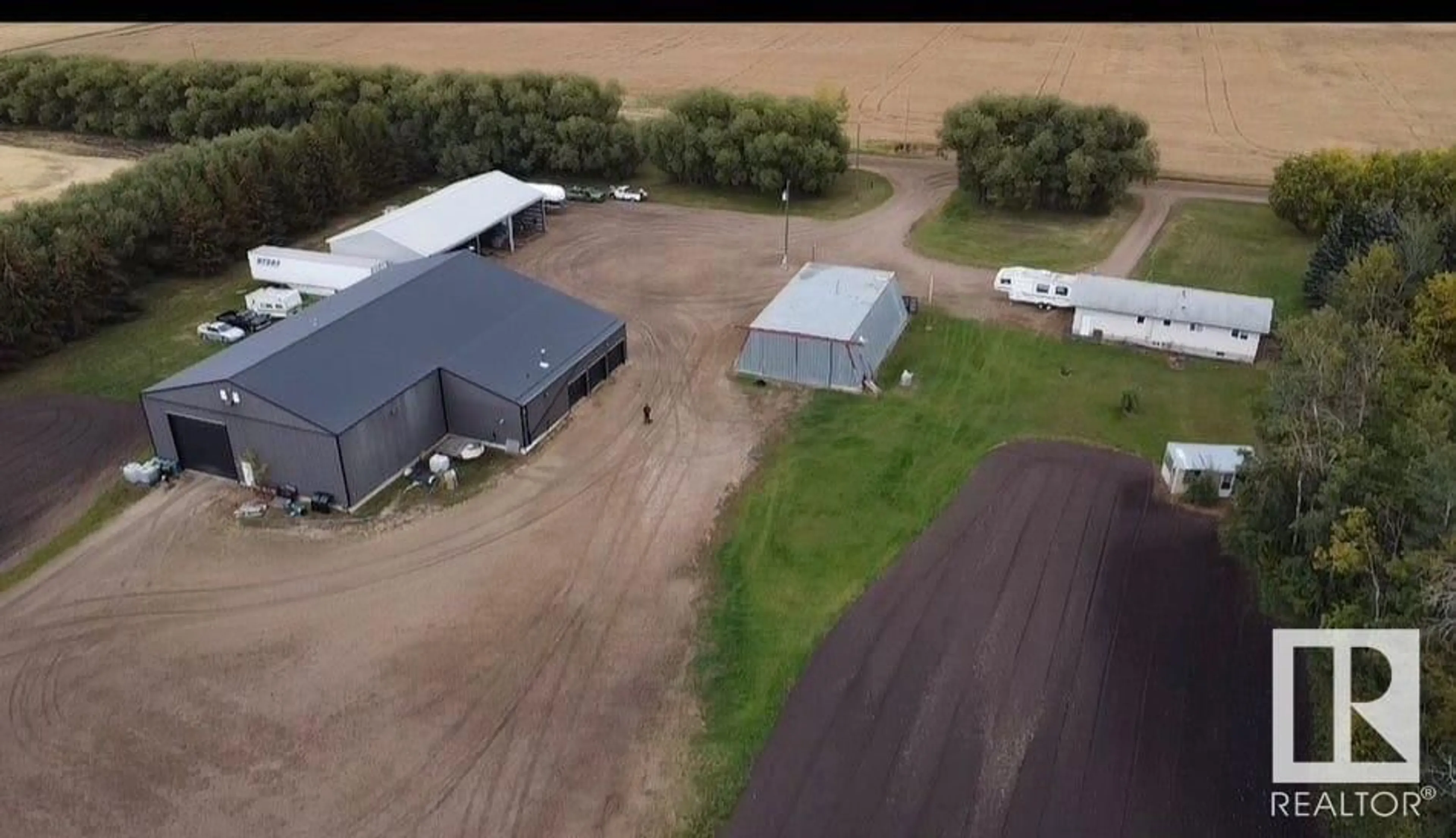 A pic from outside/outdoor area/front of a property/back of a property/a pic from drone, building for 58128 RR 251, Rural Sturgeon County Alberta T0G1L0