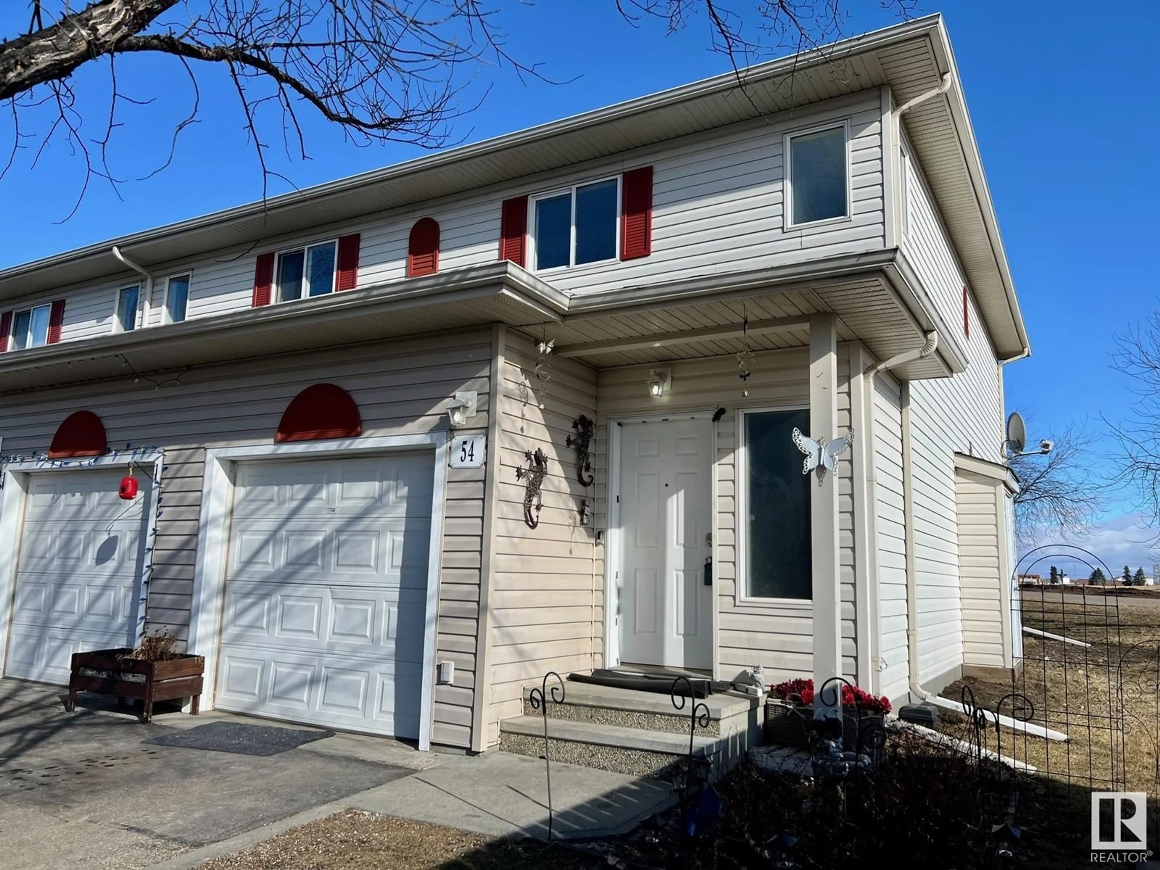 Home with vinyl exterior material, street for #54 451 HYNDMAN CR NW, Edmonton Alberta T5A5J3