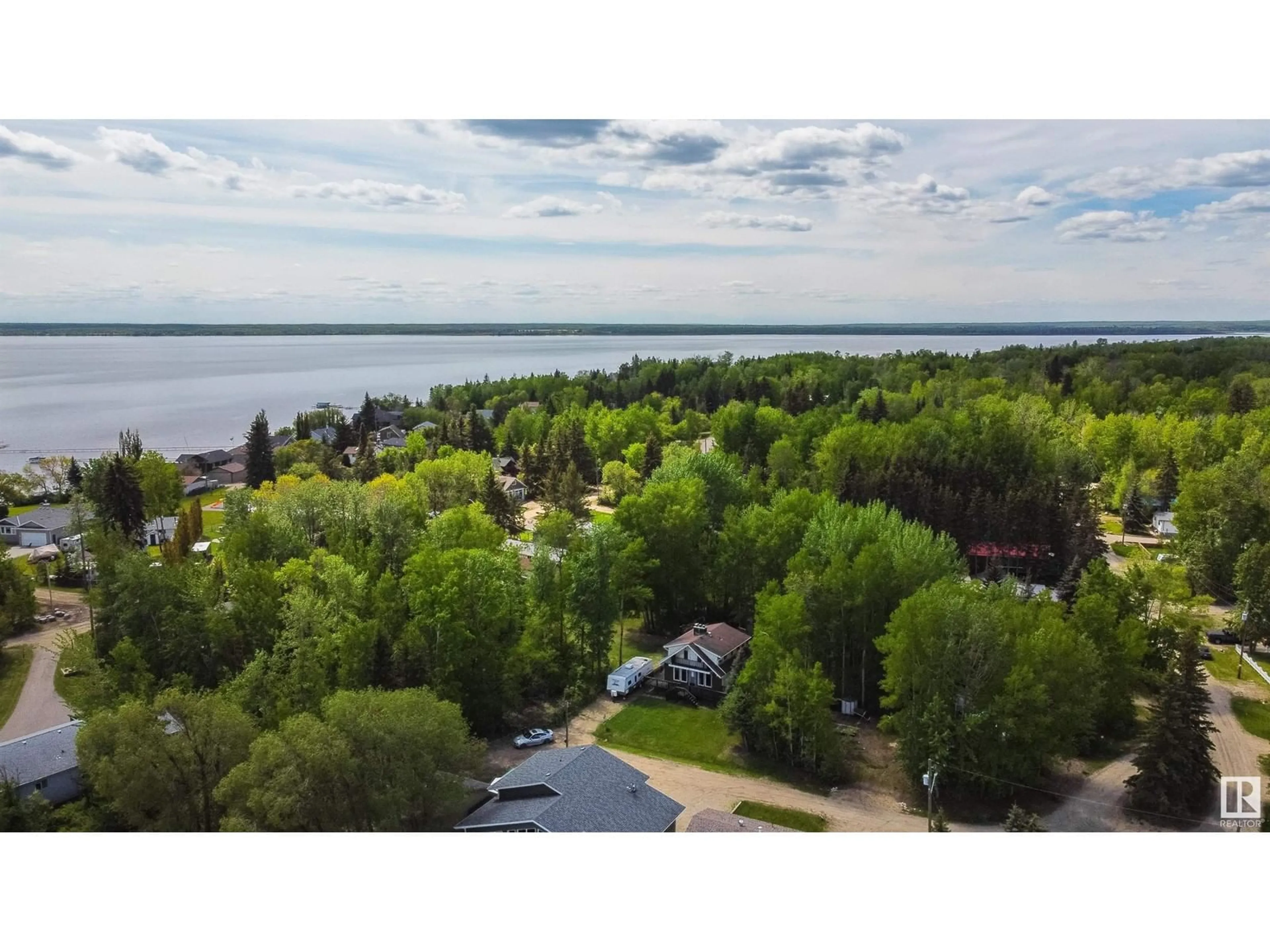 A pic from outside/outdoor area/front of a property/back of a property/a pic from drone, water/lake/river/ocean view for 329 3 ST, Rural Lac Ste. Anne County Alberta T0E1A0