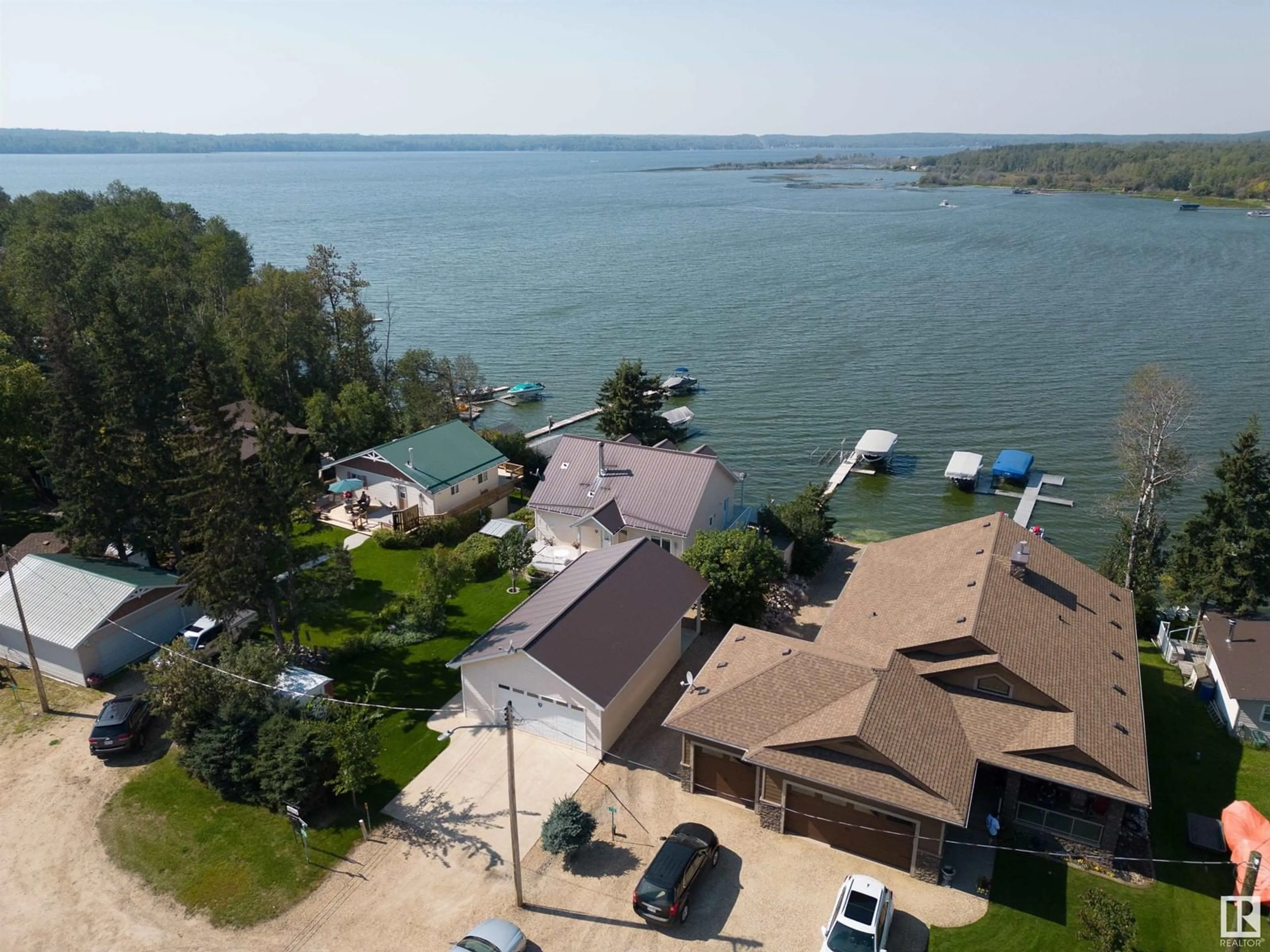 A pic from outside/outdoor area/front of a property/back of a property/a pic from drone, water/lake/river/ocean view for 713 3003 TWP RD 574, Rural Barrhead County Alberta T0E1A0