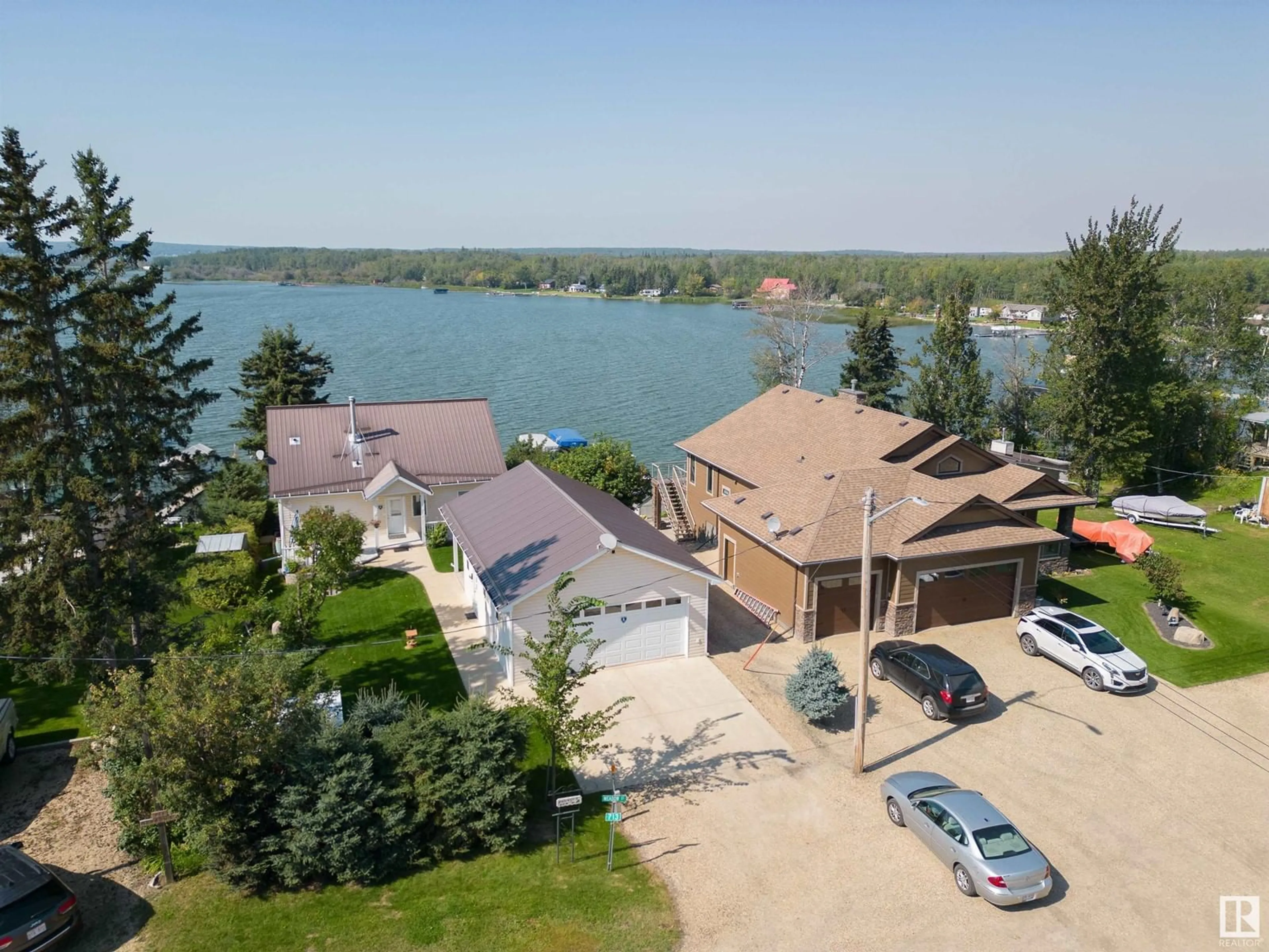 A pic from outside/outdoor area/front of a property/back of a property/a pic from drone, water/lake/river/ocean view for 713 3003 TWP RD 574, Rural Barrhead County Alberta T0E1A0