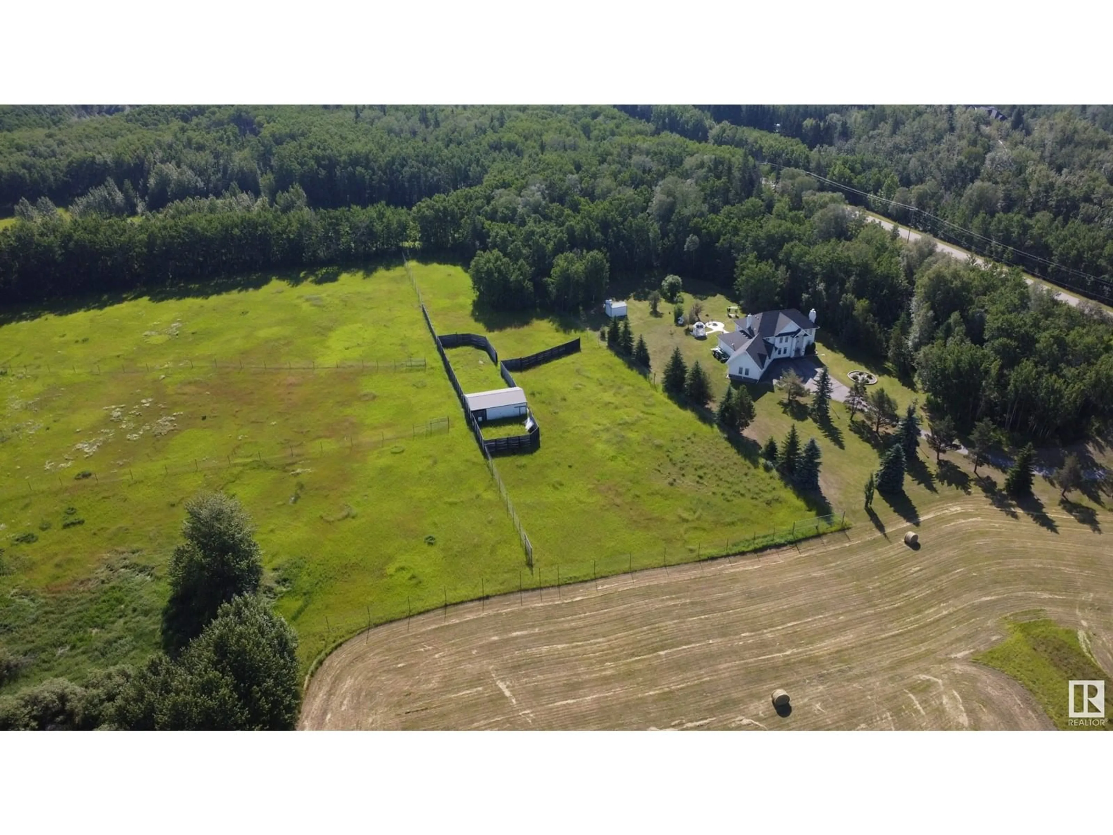 A pic from outside/outdoor area/front of a property/back of a property/a pic from drone, unknown for A - 26020 TWP RD 511, Rural Parkland County Alberta T7Y1B2