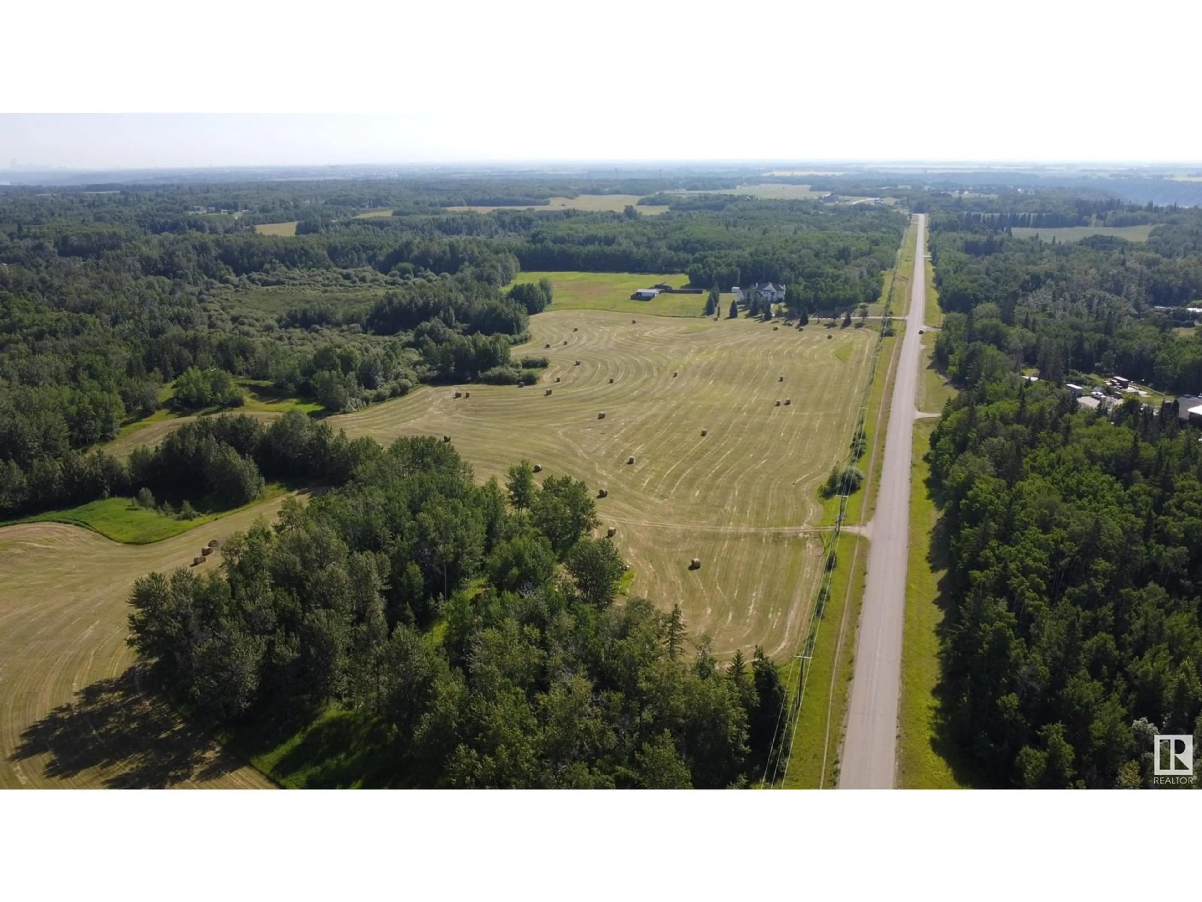 A pic from outside/outdoor area/front of a property/back of a property/a pic from drone, forest/trees view for A - 26020 TWP RD 511, Rural Parkland County Alberta T7Y1B2