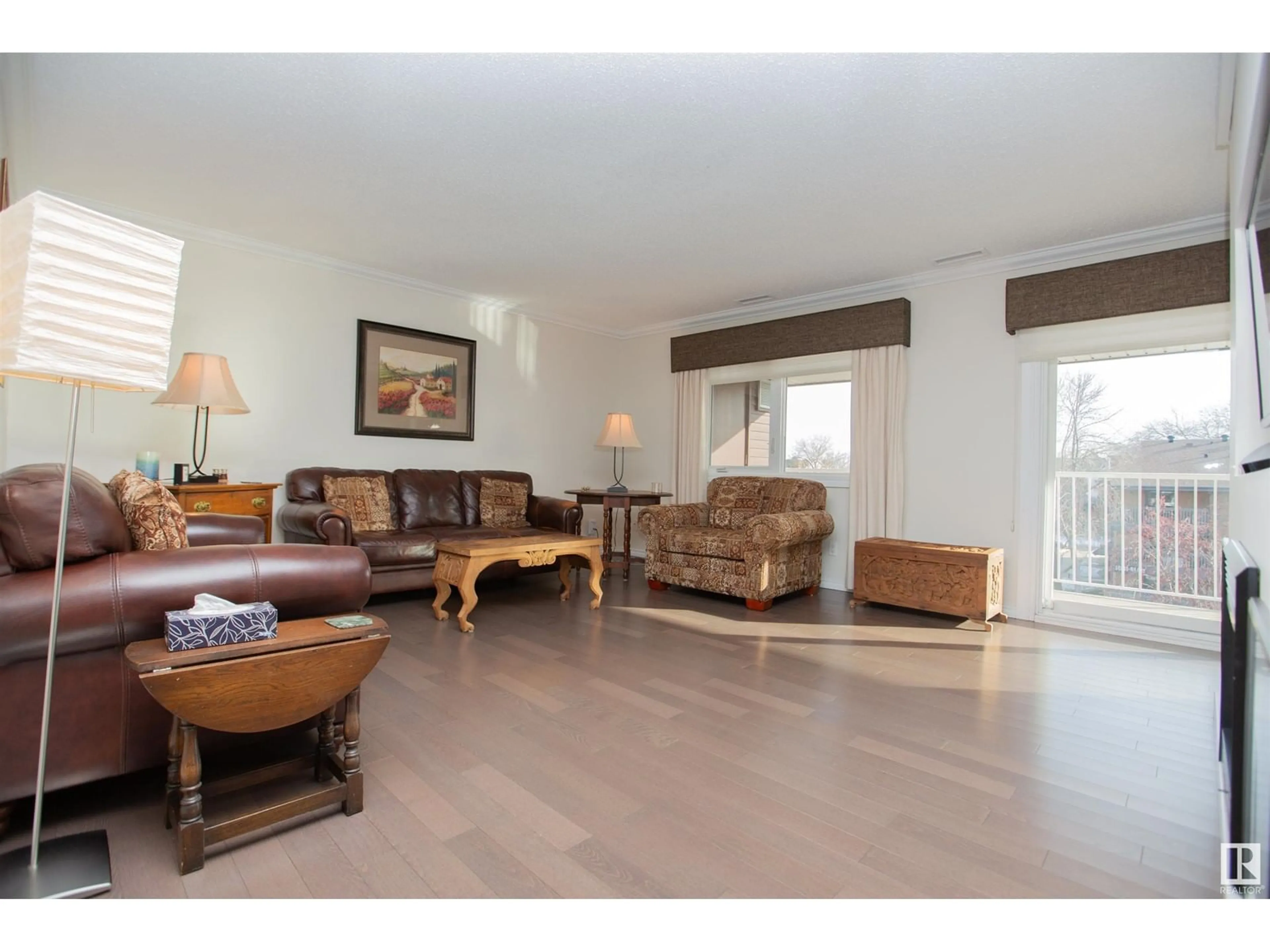 Living room with furniture, wood/laminate floor for #403 14810 51 AV NW, Edmonton Alberta T6H5G5