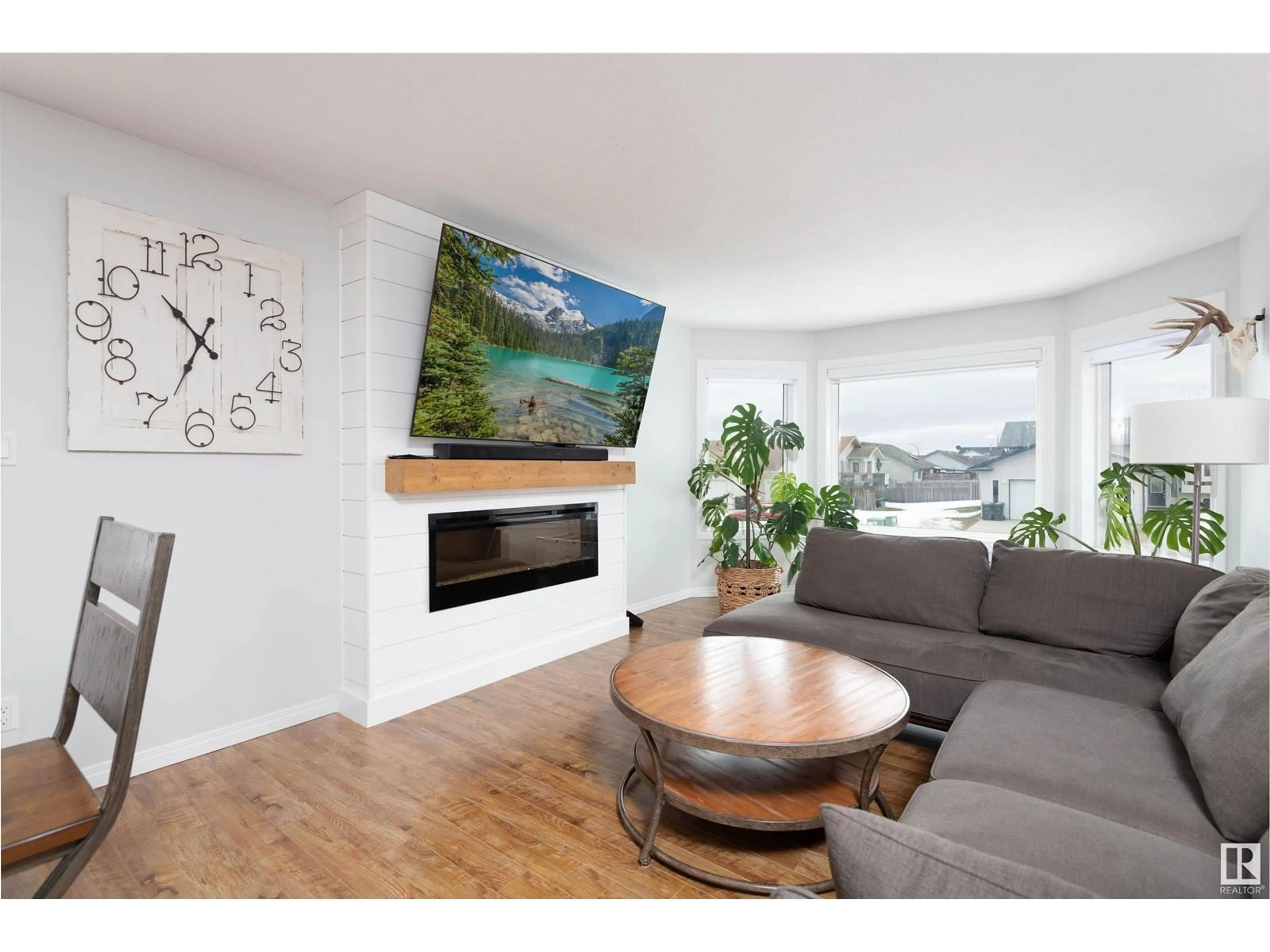 Living room with furniture, wood/laminate floor for 4706 64 AVE, Cold Lake Alberta T9M2E5