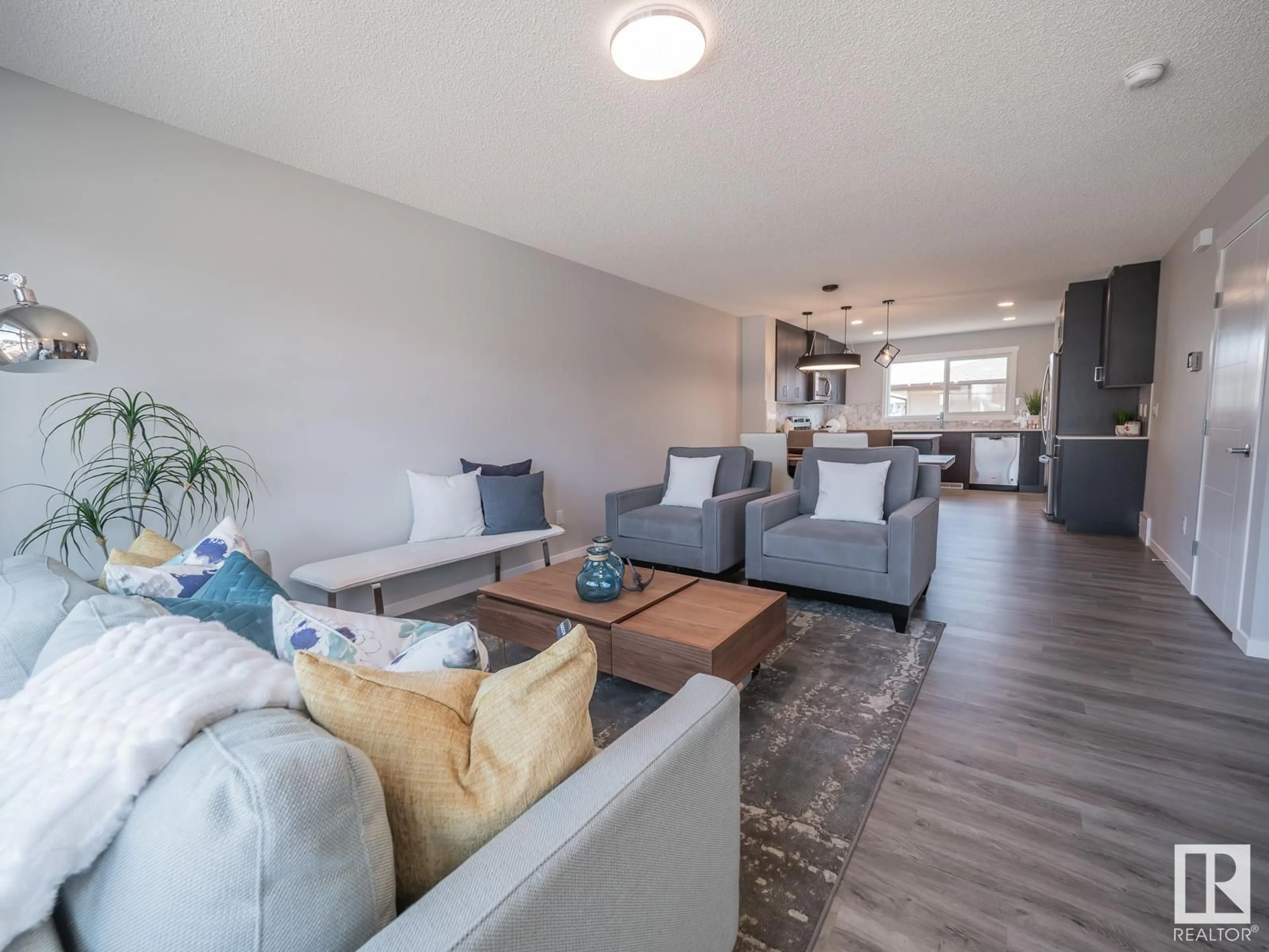 Living room with furniture, wood/laminate floor for 7212 ROSENTHAL DR NW, Edmonton Alberta T5T7W8