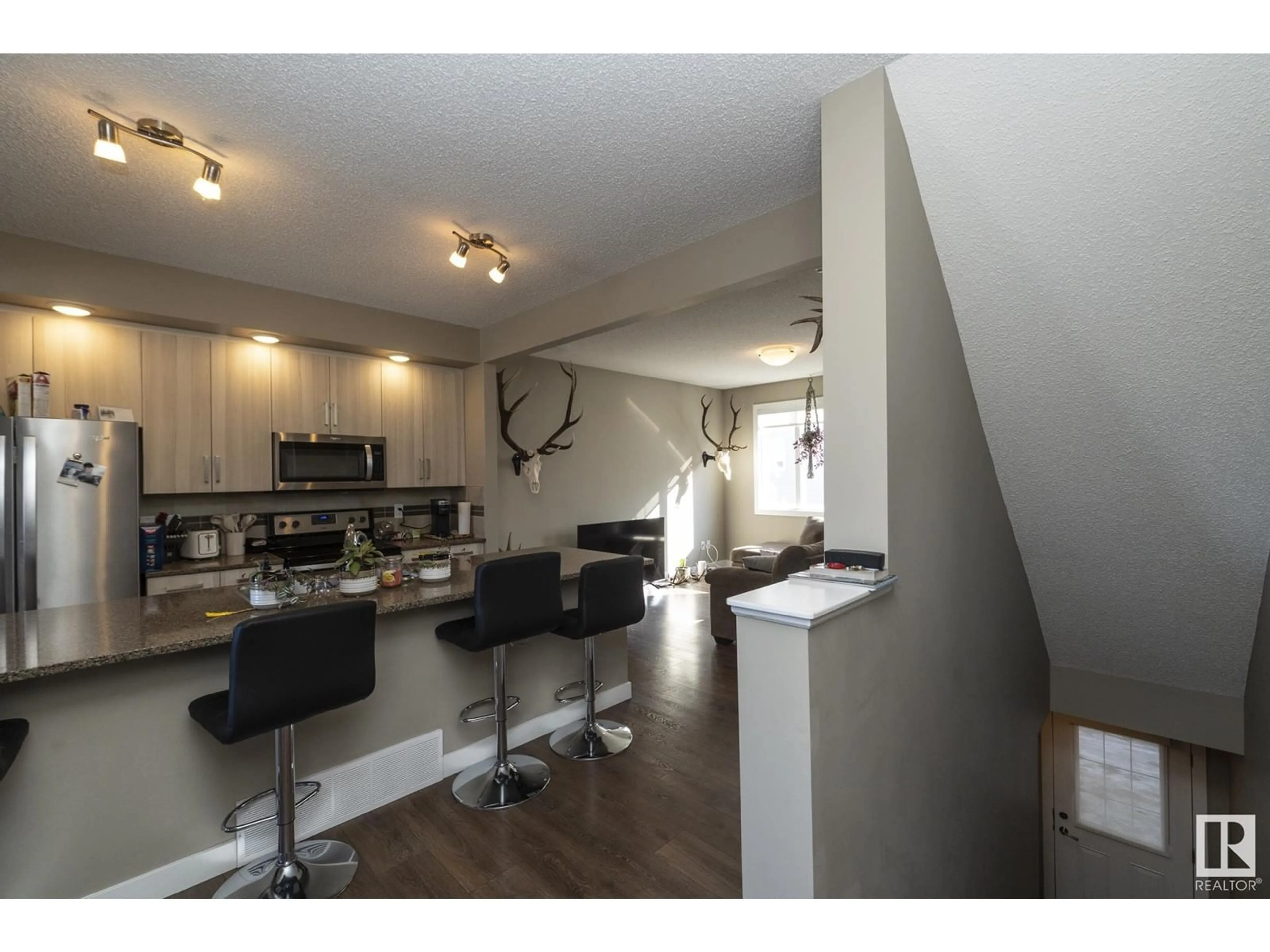 Open concept kitchen, wood/laminate floor for NW - 72 13139 205 ST, Edmonton Alberta T5S0N1