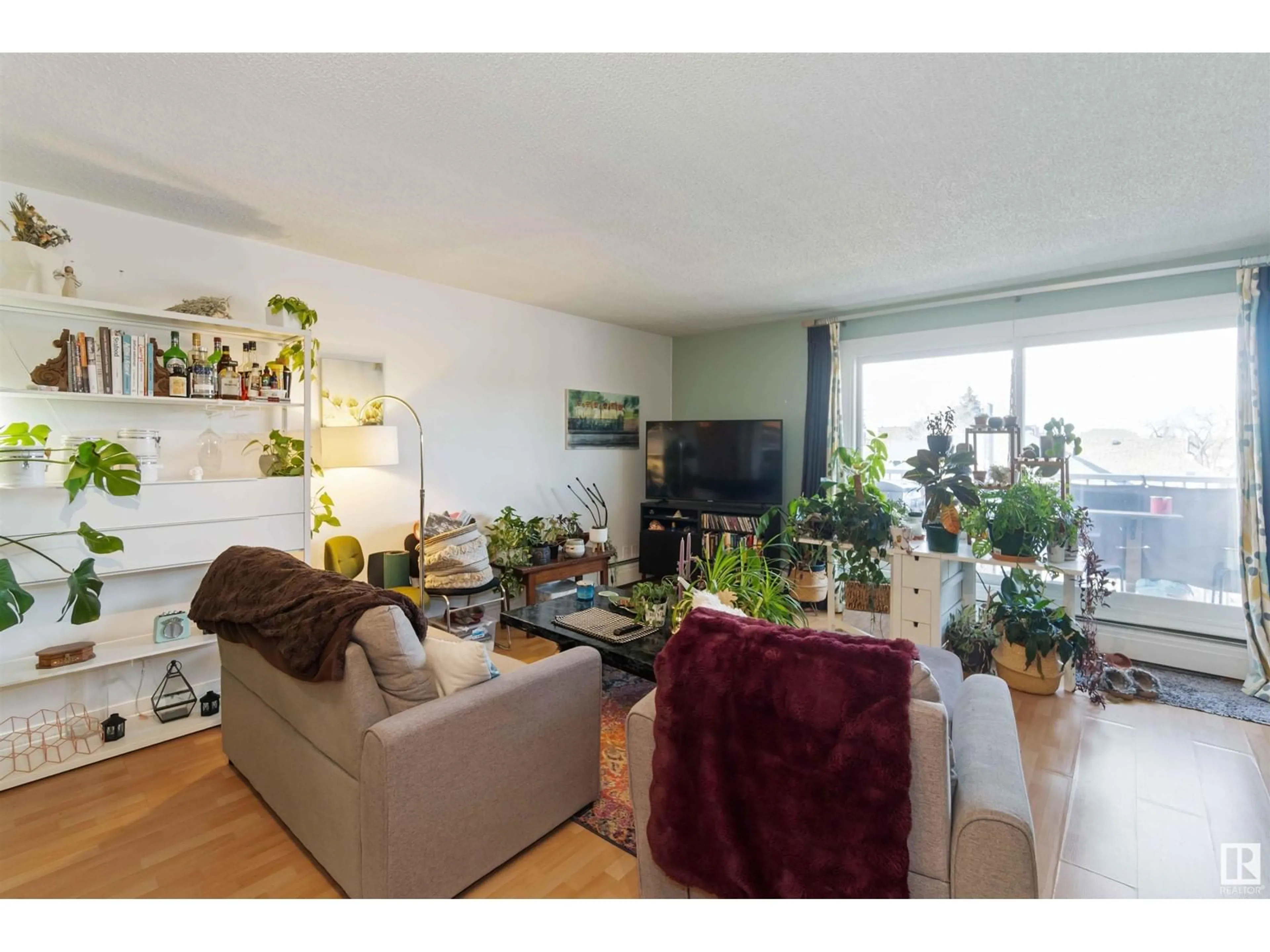 Living room with furniture, wood/laminate floor for #405 10434 125 ST NW, Edmonton Alberta T5N1T3