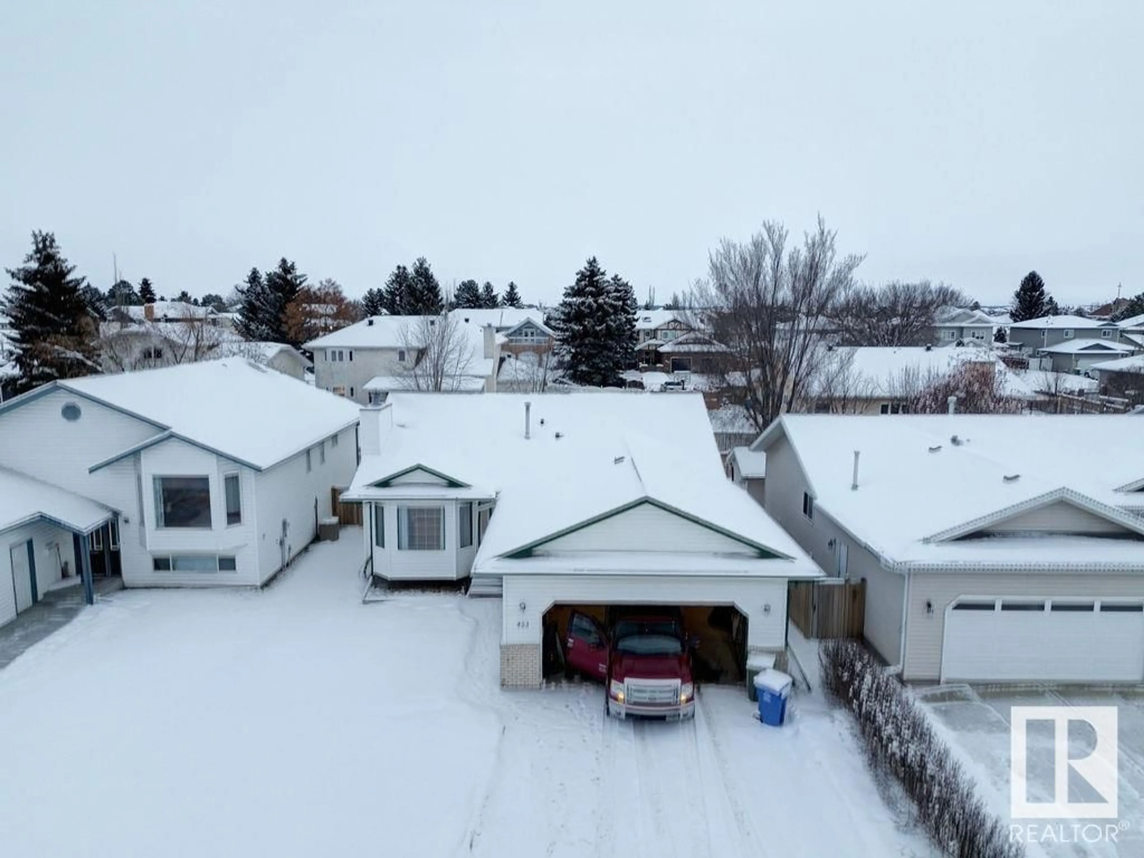 A pic from outside/outdoor area/front of a property/back of a property/a pic from drone, street for 453 Garden Meadows DR, Wetaskiwin Alberta T9A3K3