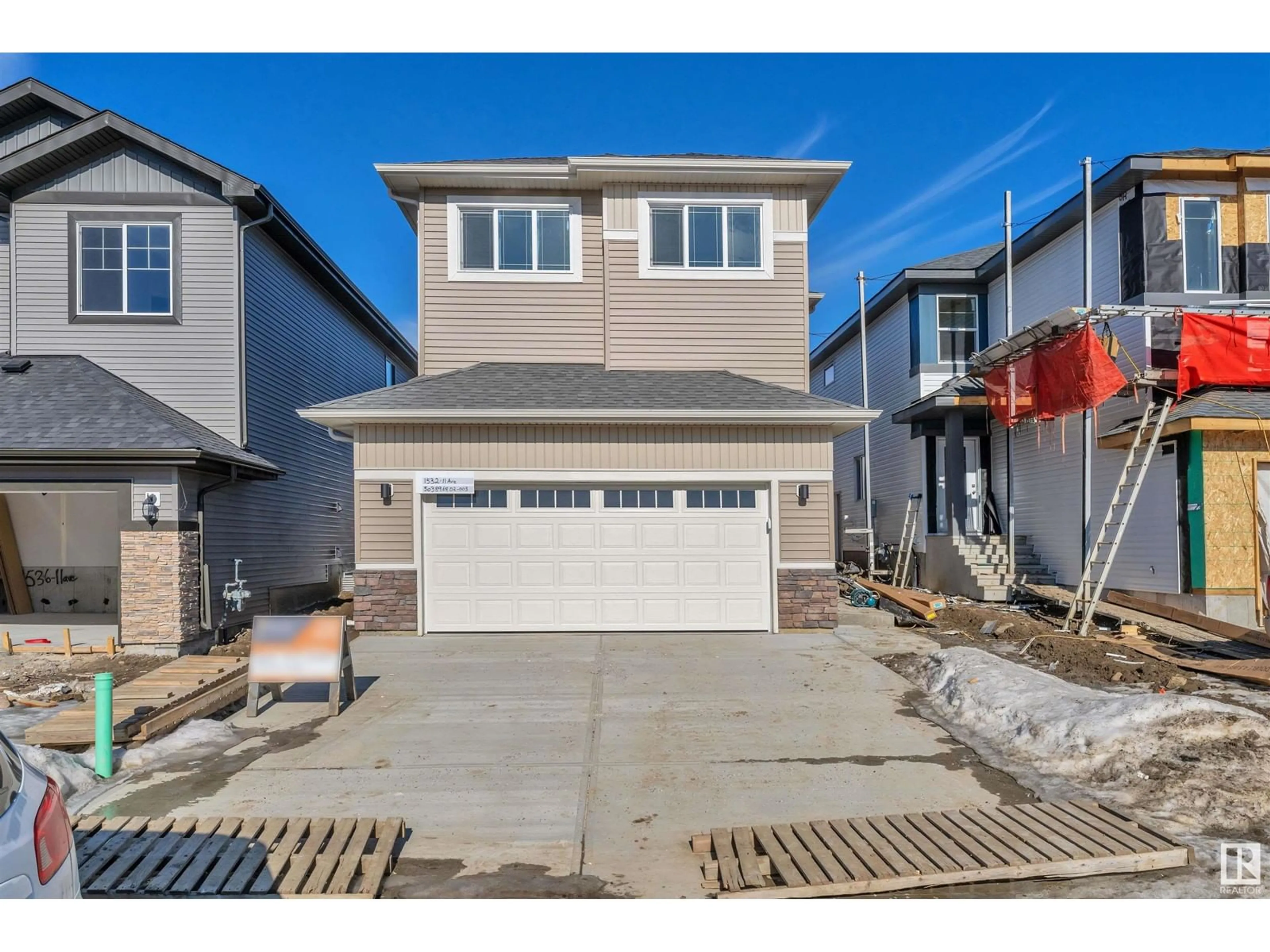 Home with vinyl exterior material, street for 1532 11 AV NW, Edmonton Alberta T6T2W4