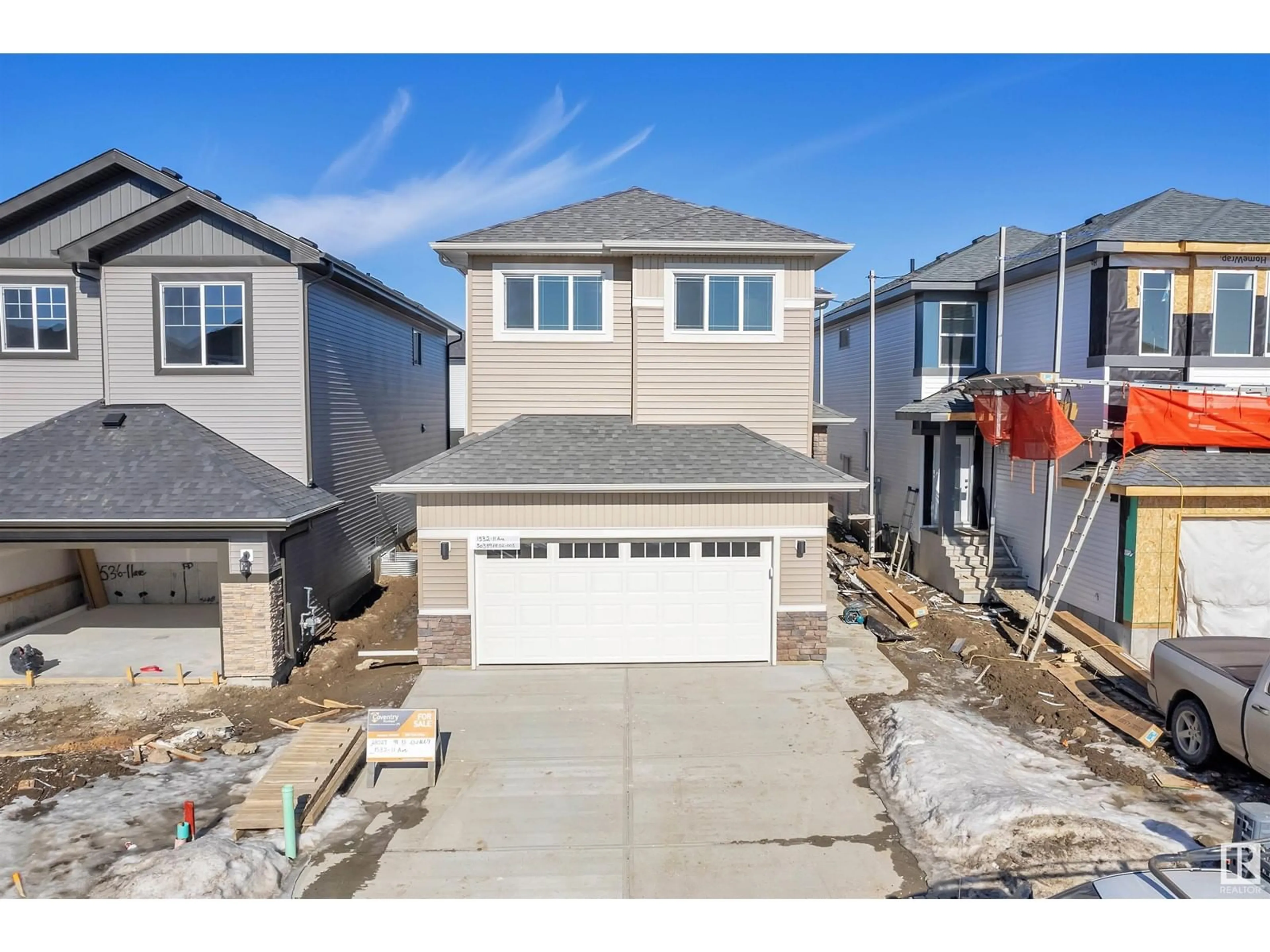 Home with vinyl exterior material, street for 1532 11 AV NW, Edmonton Alberta T6T2W4