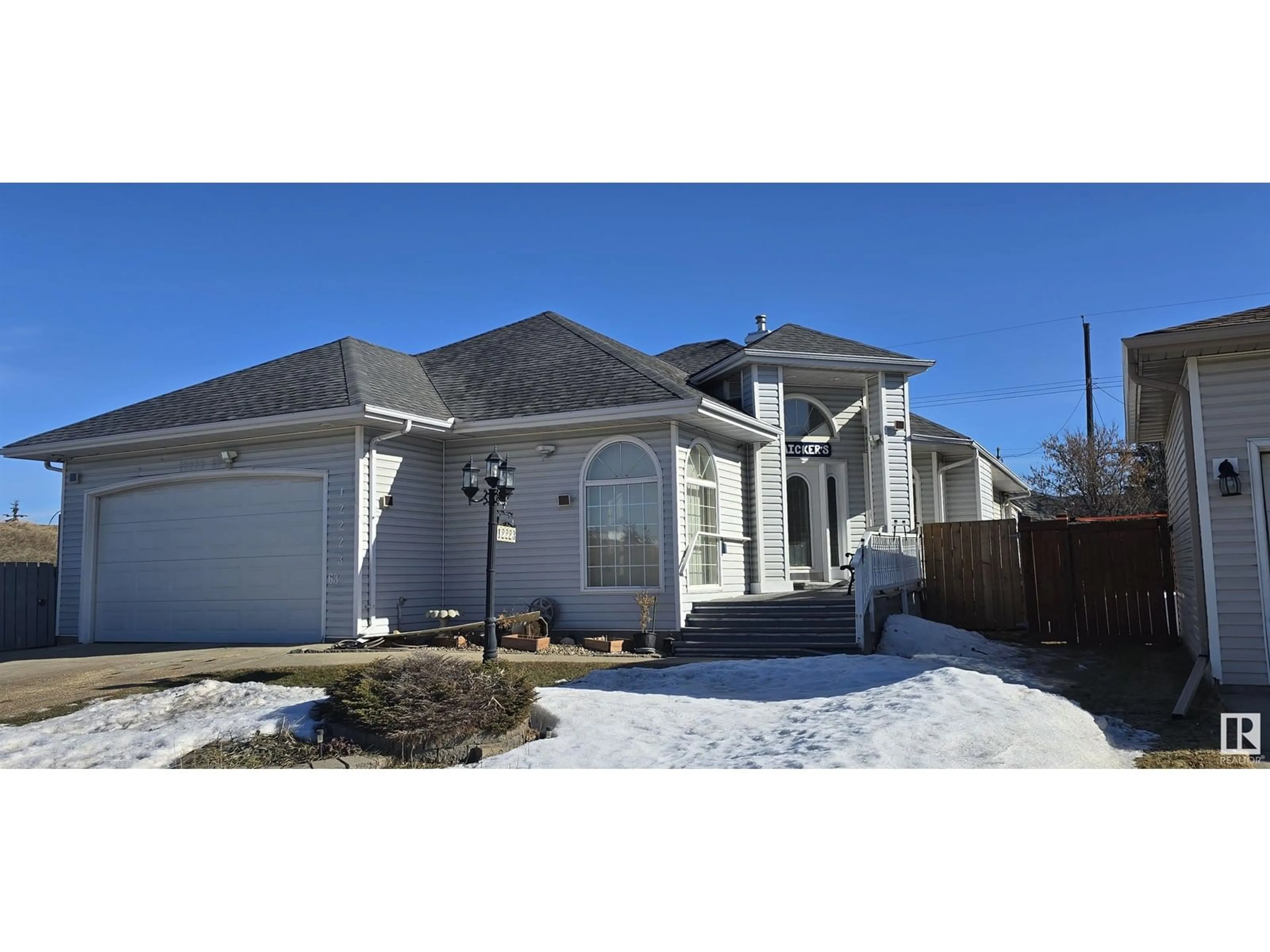 Home with vinyl exterior material, street for 12223 63 ST NW, Edmonton Alberta T5W5G7