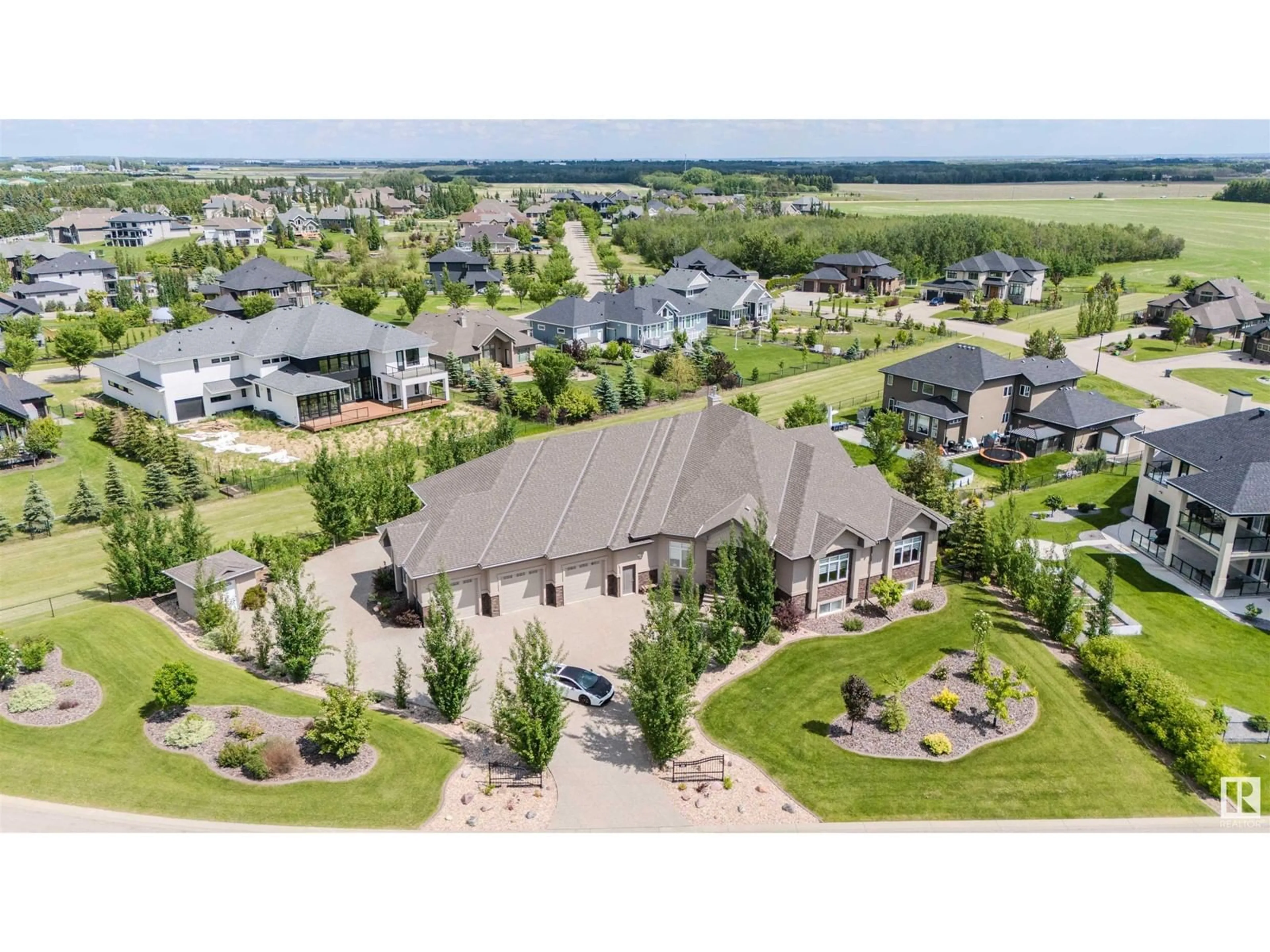 A pic from outside/outdoor area/front of a property/back of a property/a pic from drone, unknown for 224 54302 Rge Rd 250, Rural Sturgeon County Alberta T8T0C9