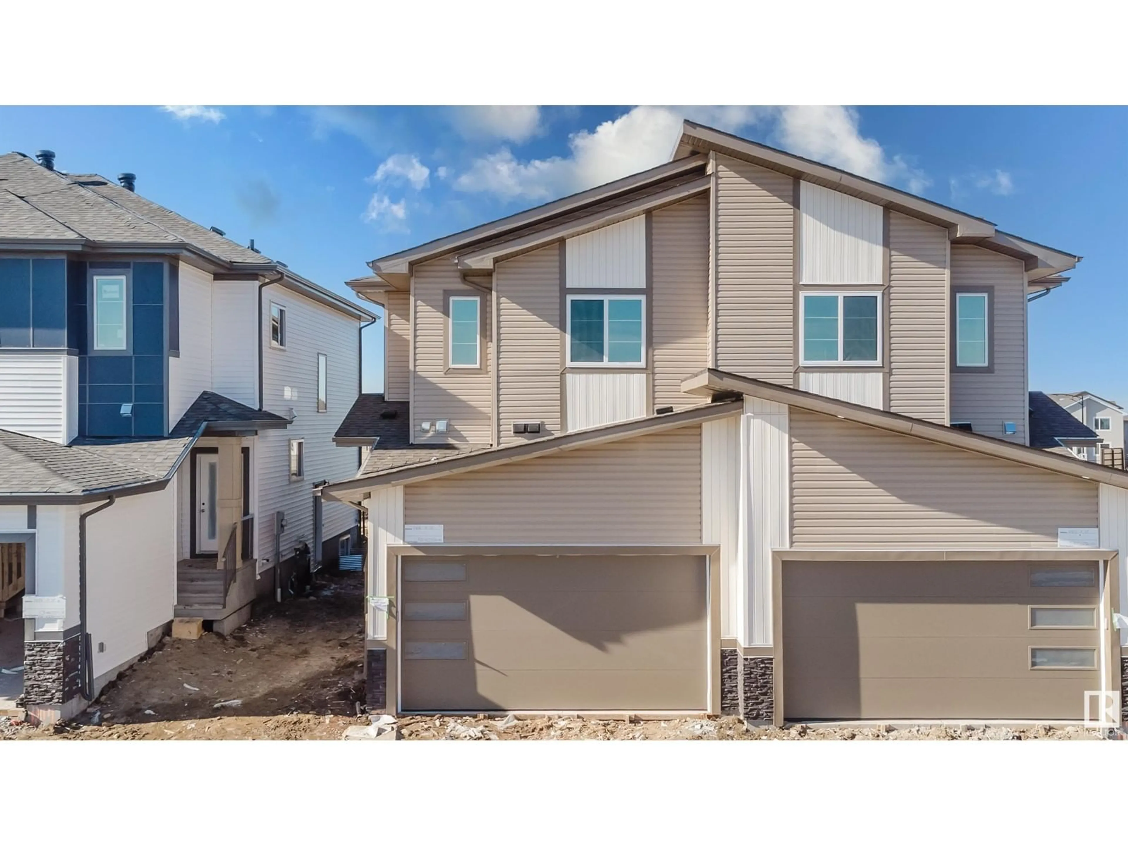 Home with vinyl exterior material, street for 1418 11 ST NW, Edmonton Alberta T6T0G9